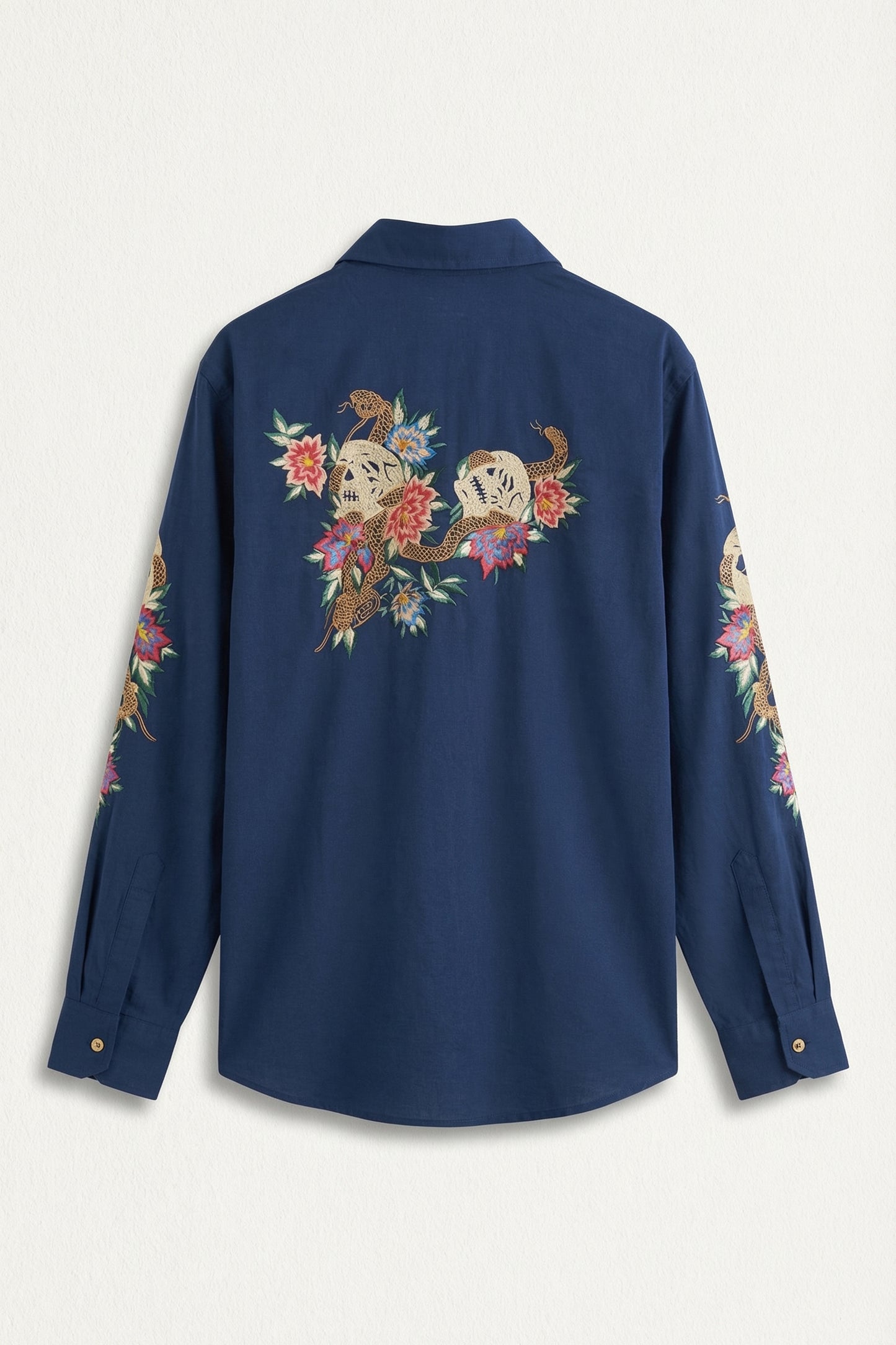 Navy blue shirt with floral embroidery on sleeves against a white background