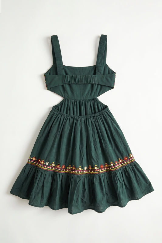 Green dress with decorative hem on a white background
