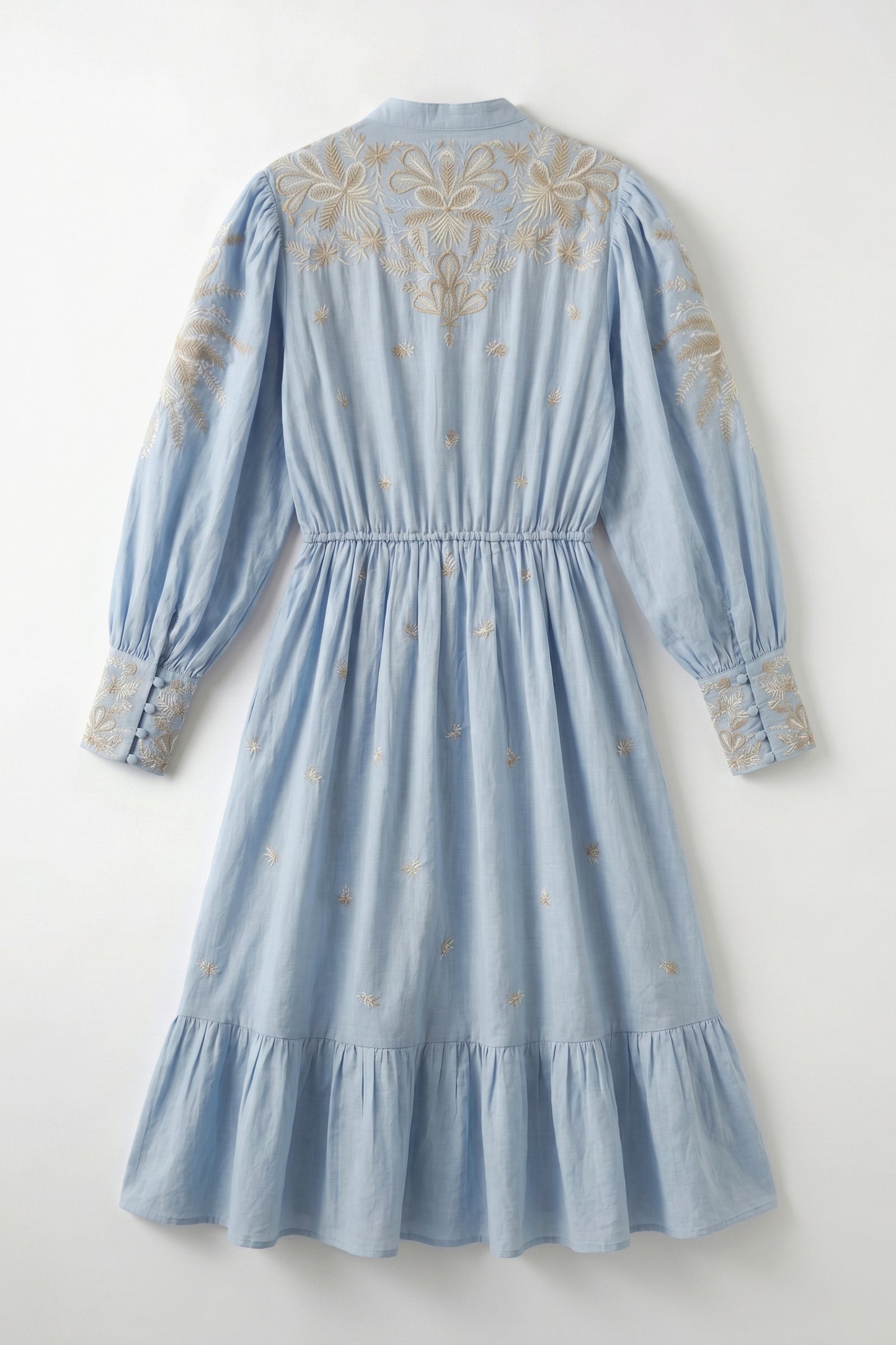 Light blue dress with intricate gold embroidery on a white background