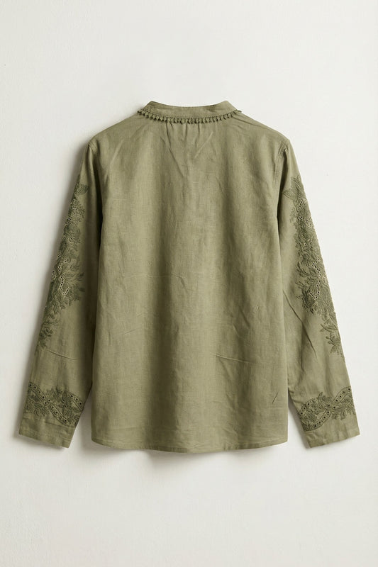Green shirt with lace sleeves on a white background