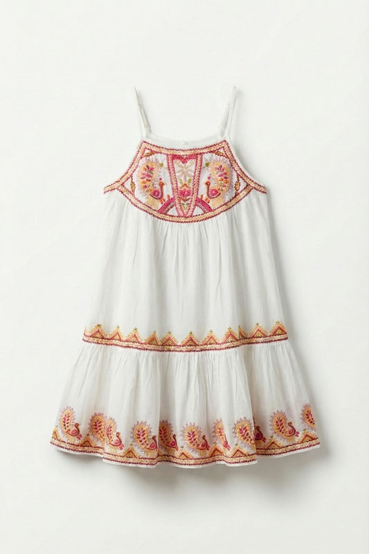 White dress with red and orange floral embroidery on a white background