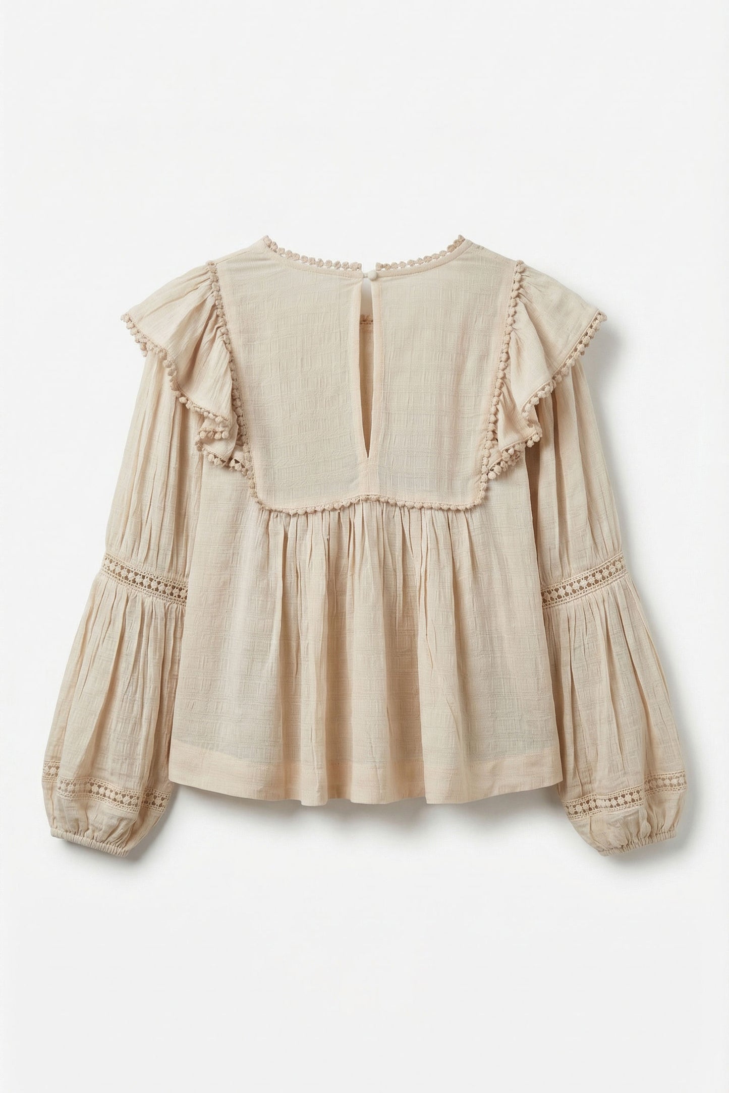 Beige blouse with ruffled details on a white background