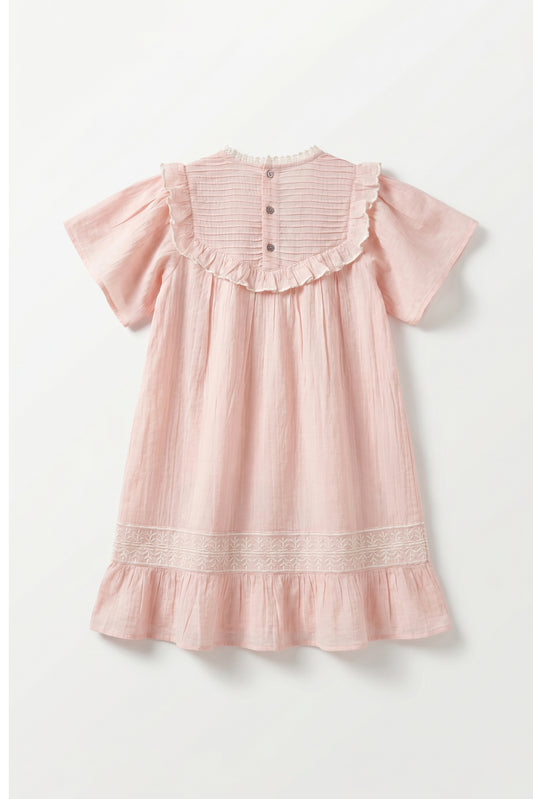 Pink dress with ruffled sleeves and hem on a white background