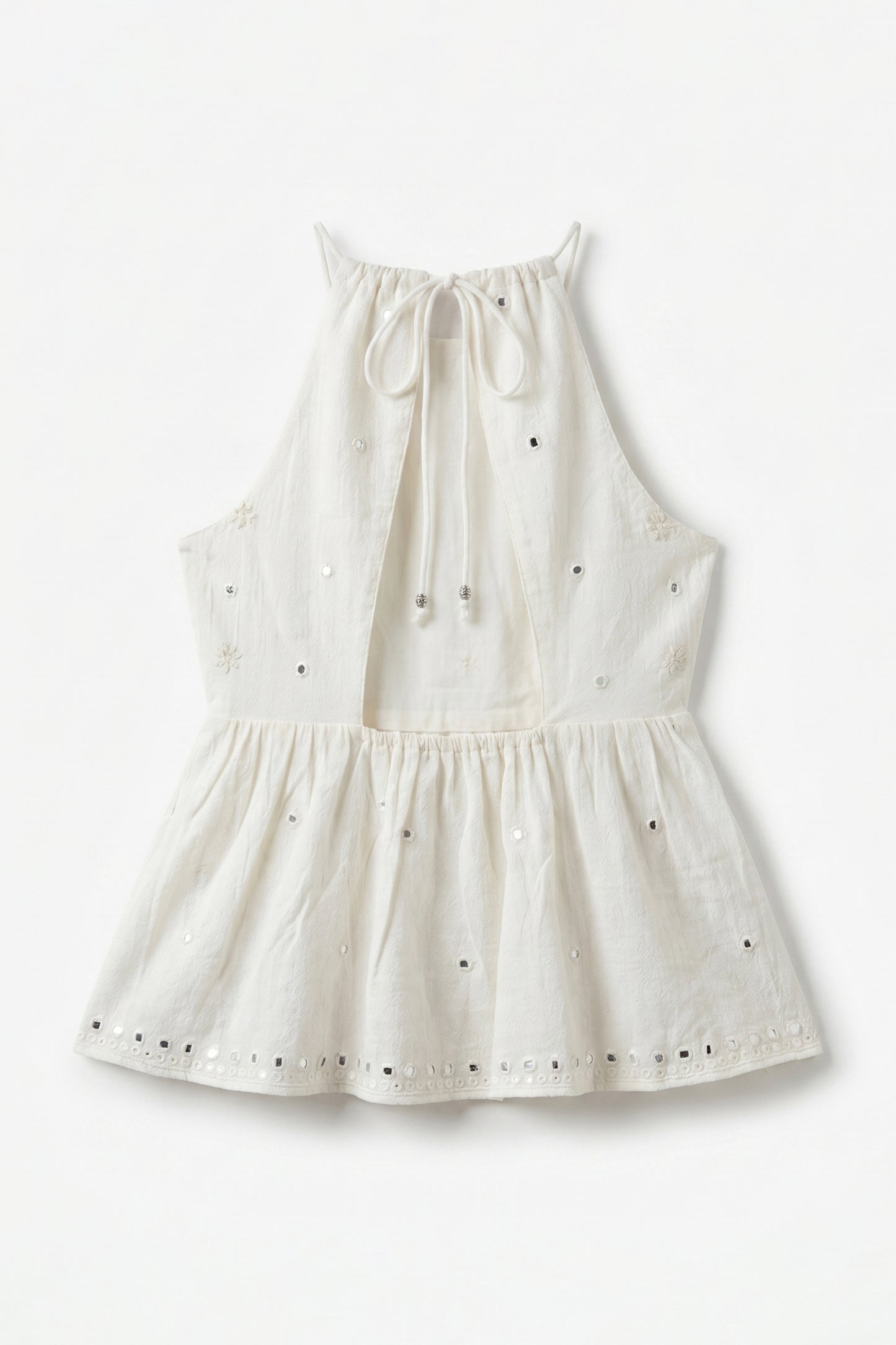 White dress with black polka dots on a white background