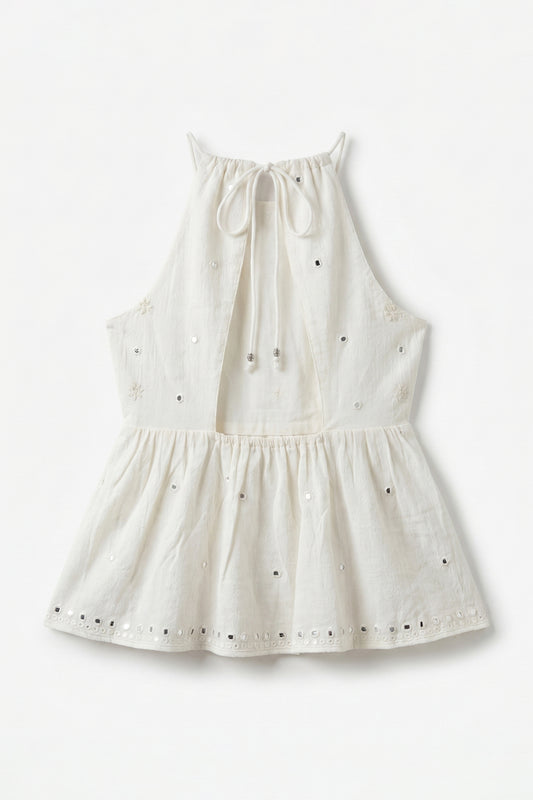 White dress with black polka dots on a white background