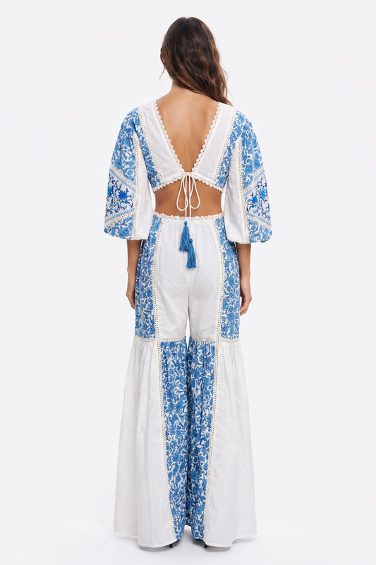 Women's long jumpsuit with embroidery and lace details.