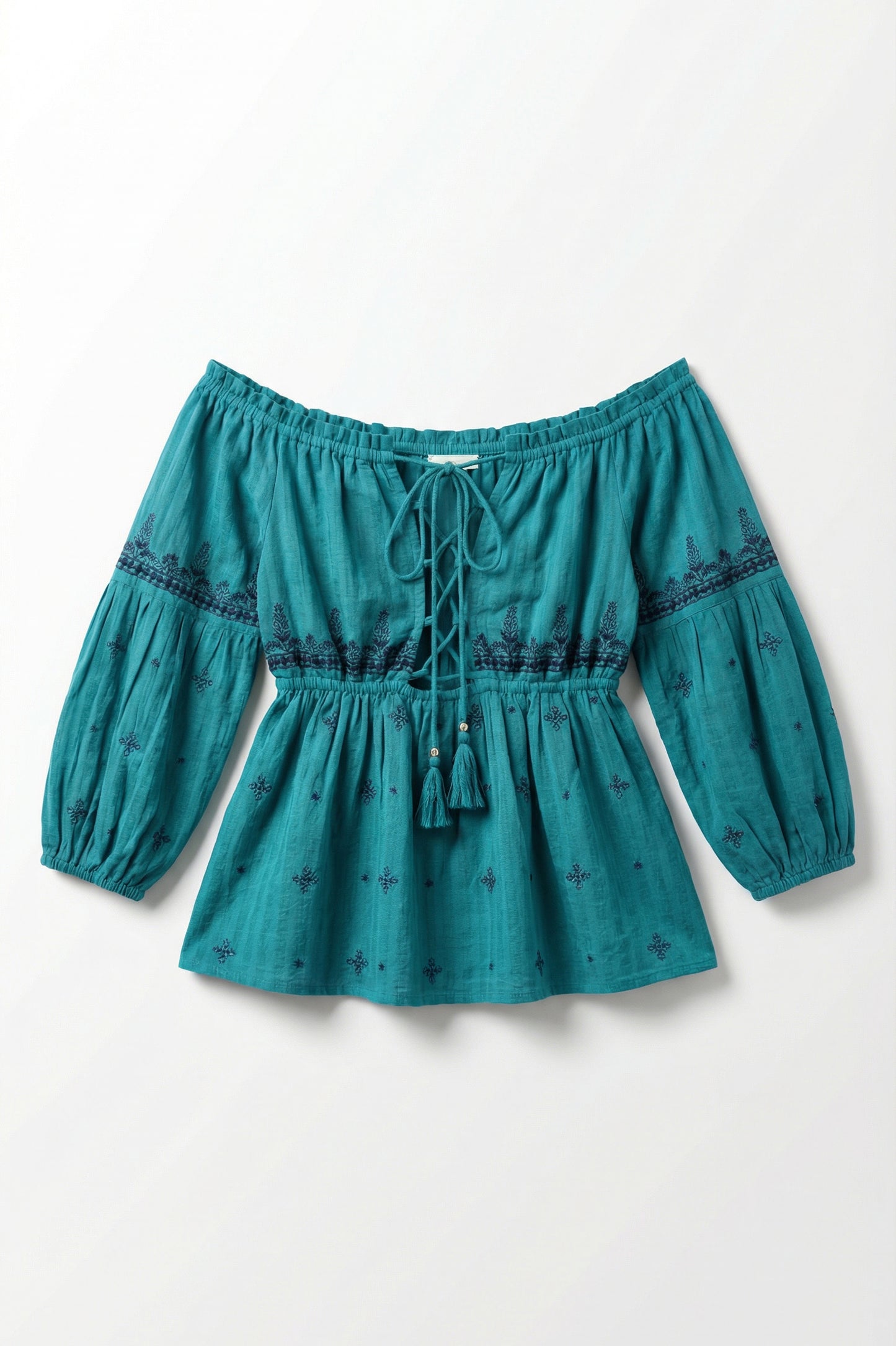 Teal blouse with long sleeves and lace details on a white background