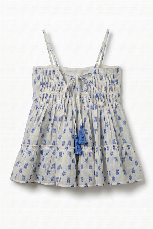 Back view of Vincent Pintuck Top for women showcasing adjustable tie-back with tassels, pintuck detailing, cotton dobby fabric, and tiered peplum design.