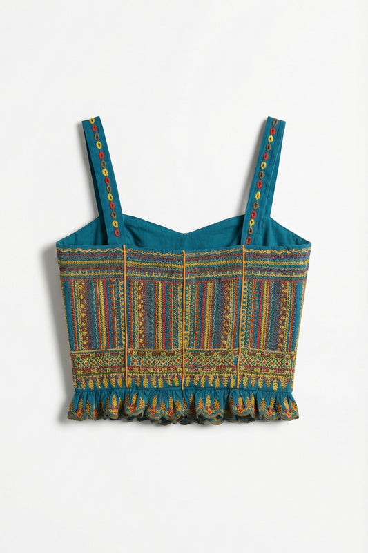 Blue patterned crop top with colorful straps on a white background