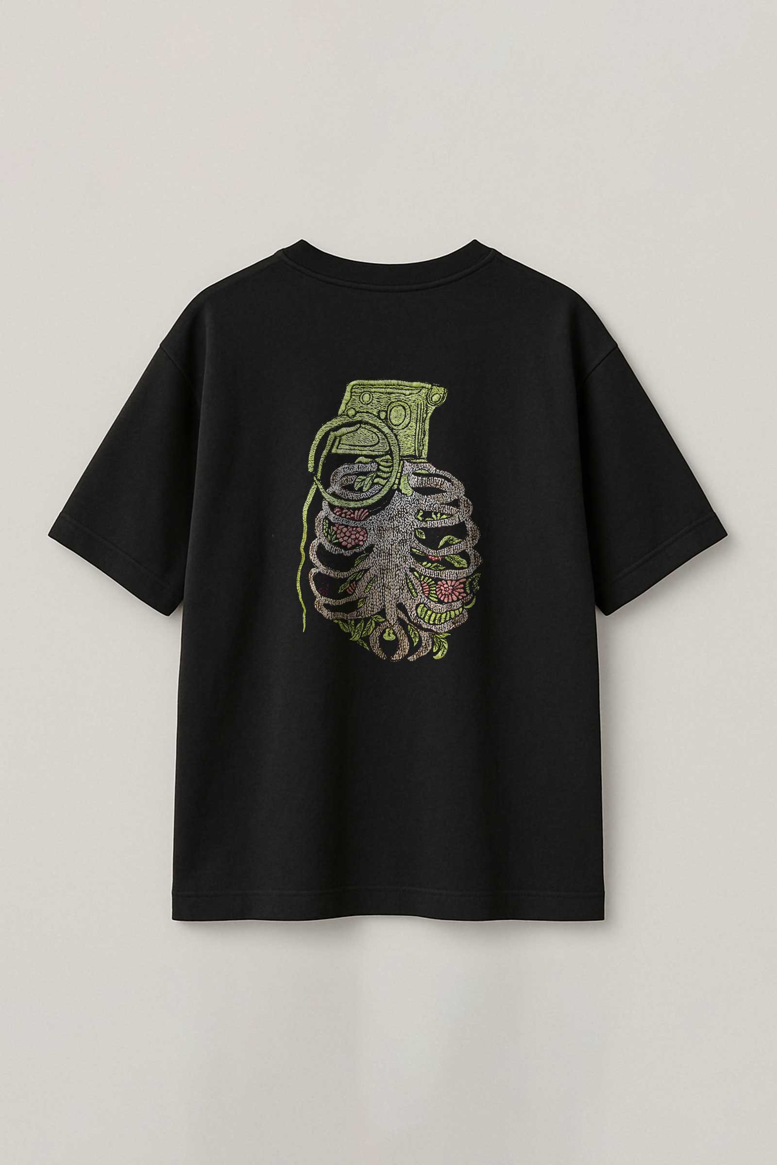 Black t-shirt with a graphic design on the back against a light gray background