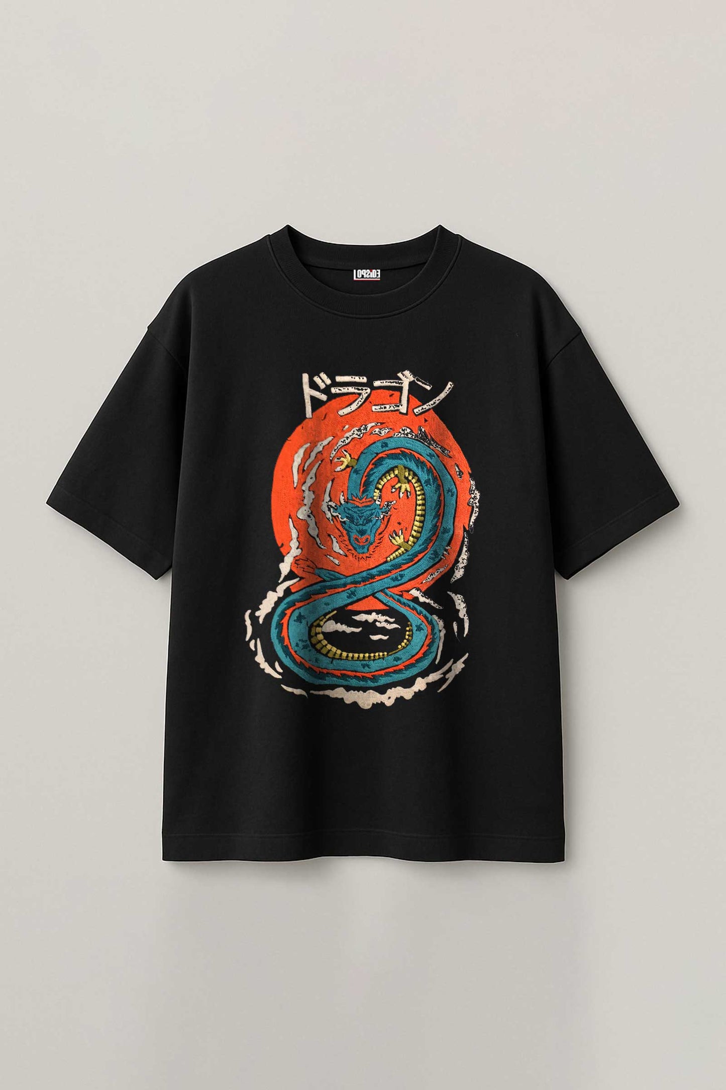 Black t-shirt with a dragon graphic and Japanese text on a light gray background