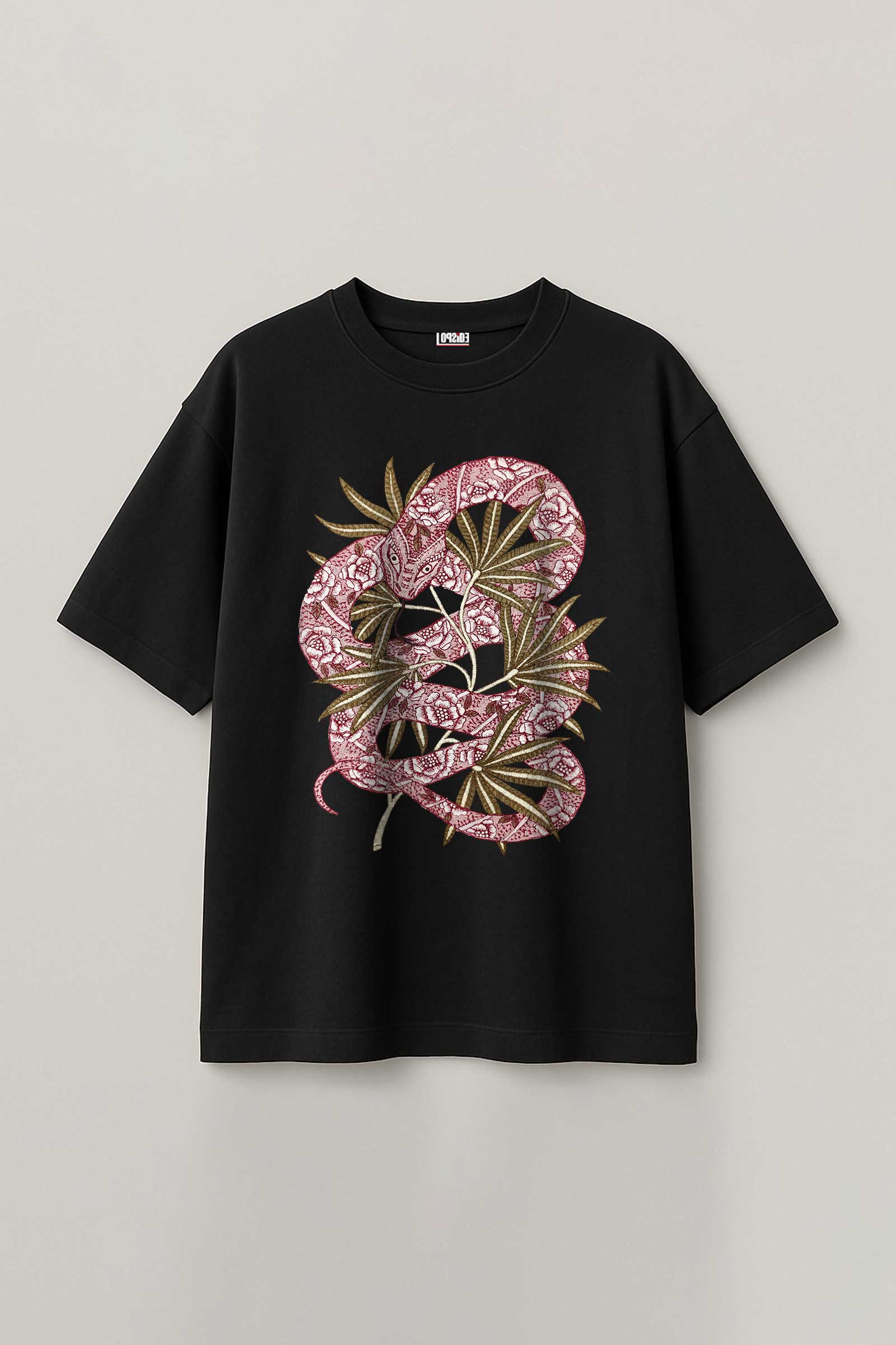 Black t-shirt with pink snake and leaf design on a light gray background