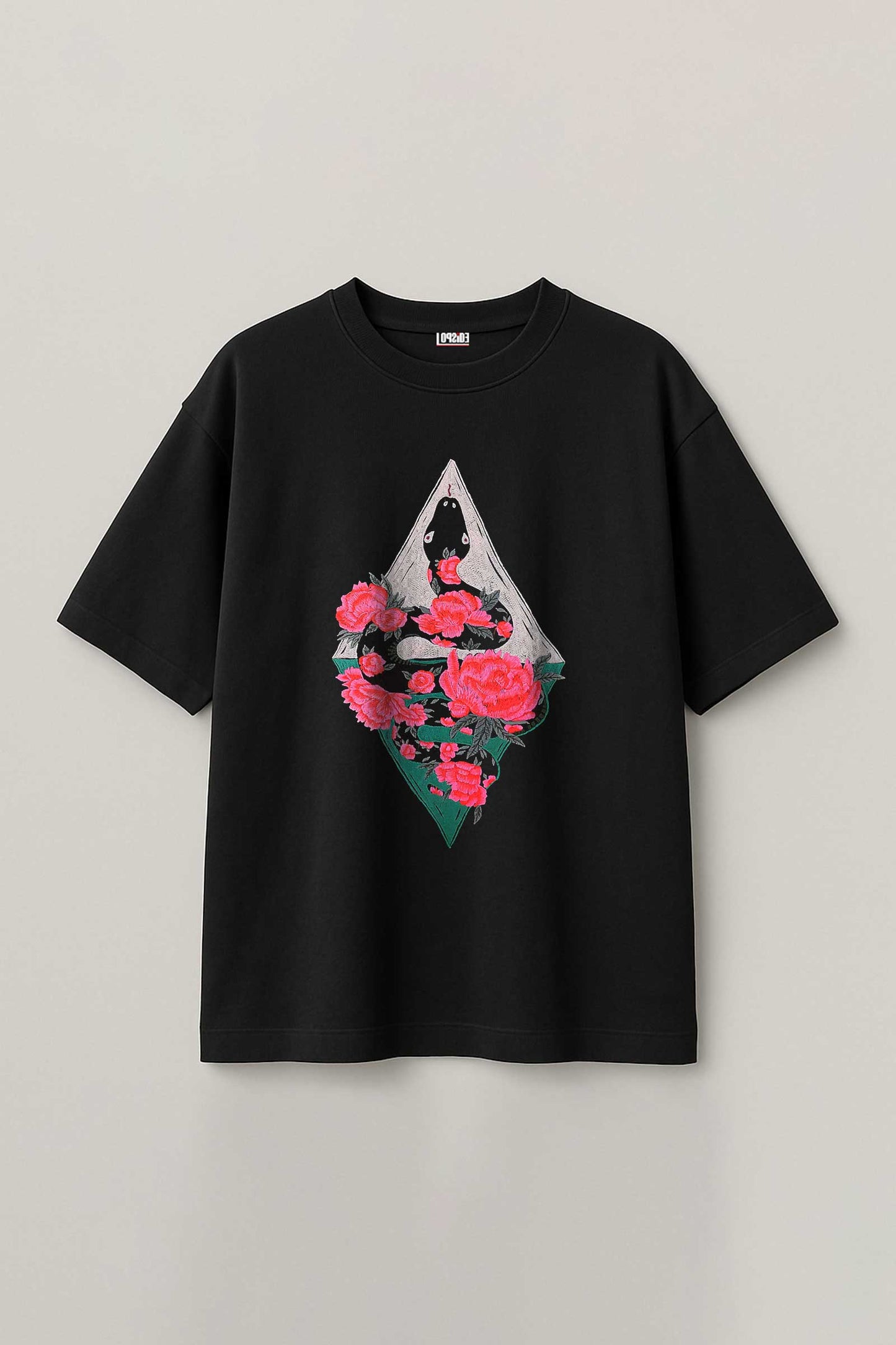 Black t-shirt with a geometric design featuring roses on a light gray background