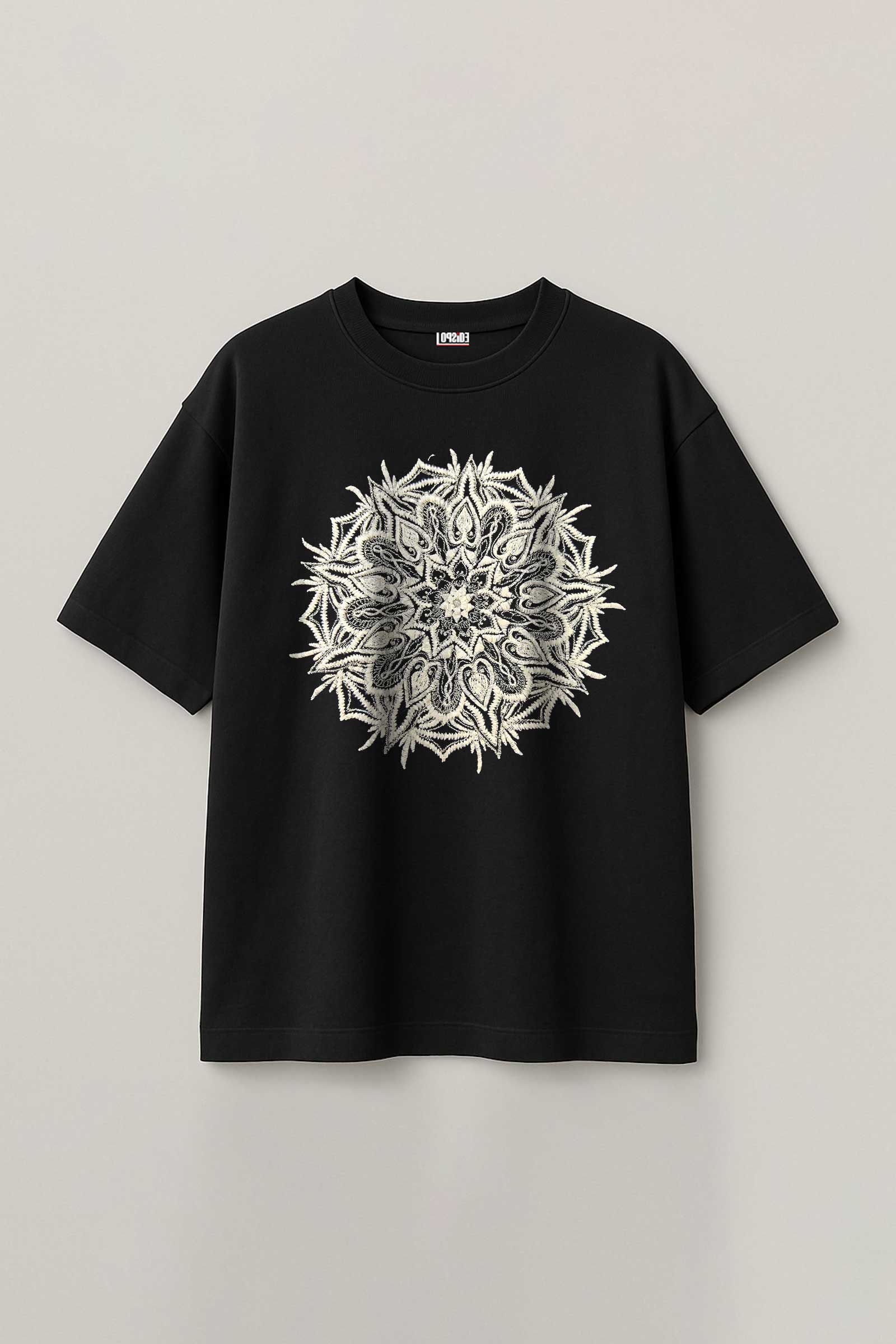Black t-shirt with a white floral design on a light gray background