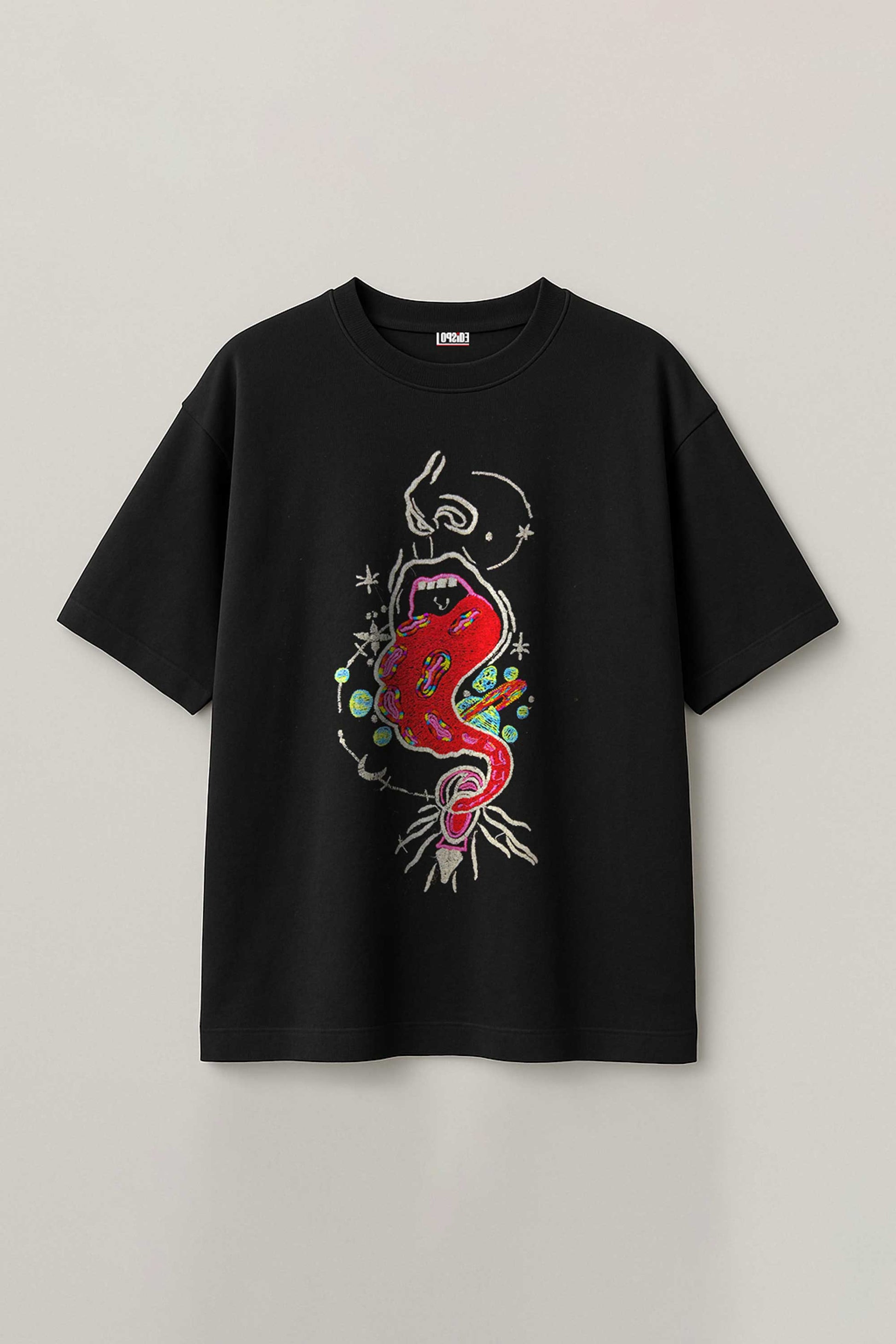 Black t-shirt with colorful graphic design on a light gray background