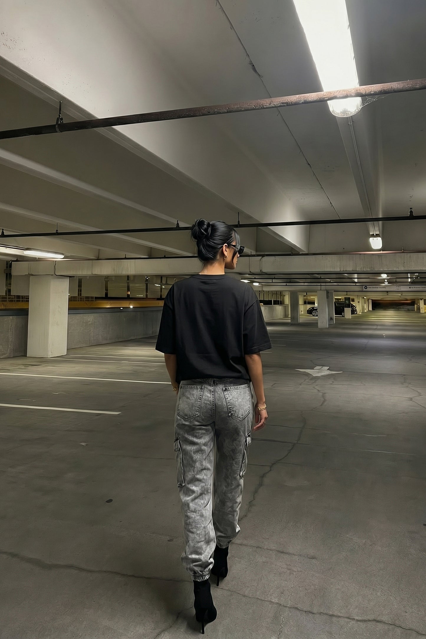 Person walking in an underground parking lot