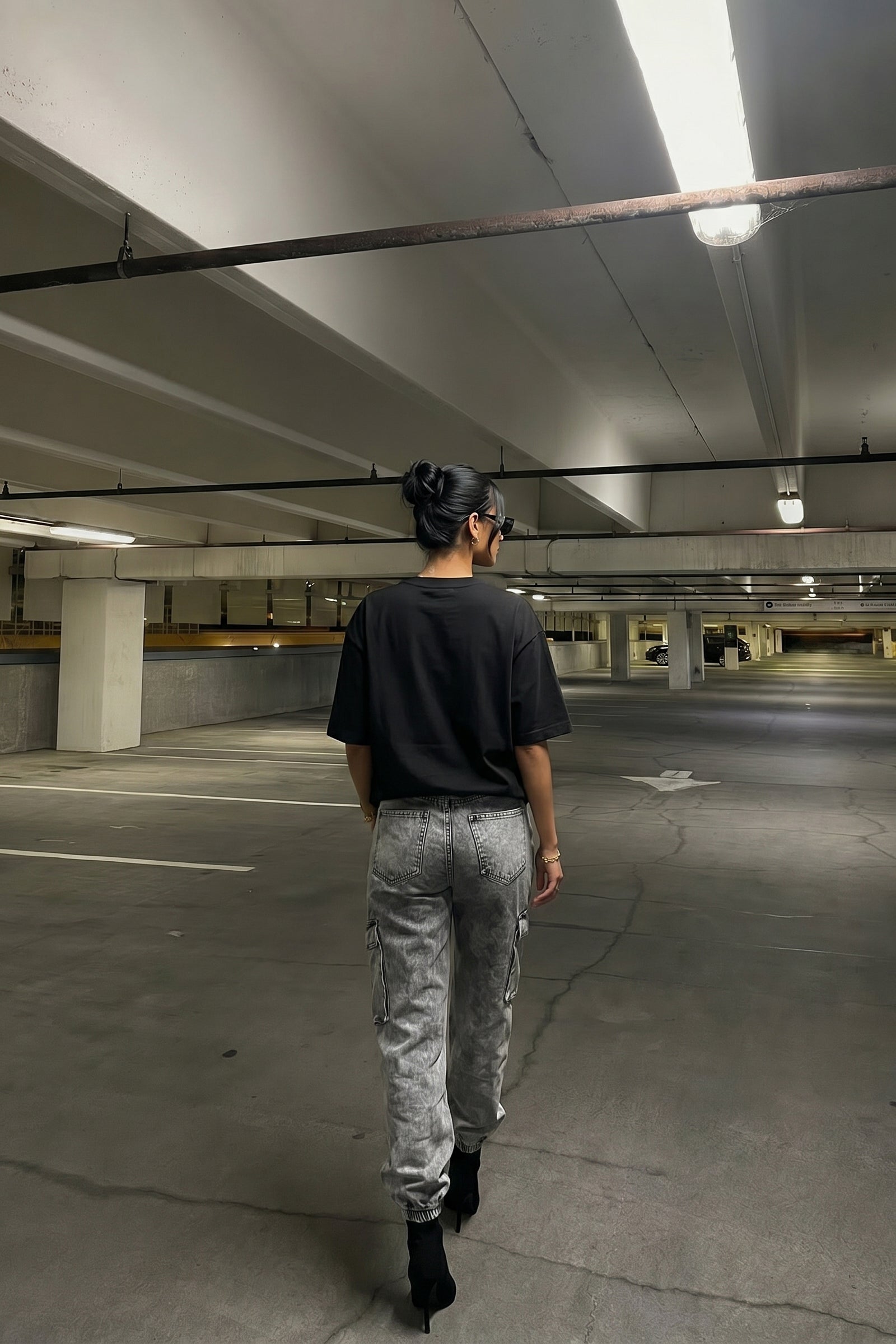 Person walking in an underground parking lot
