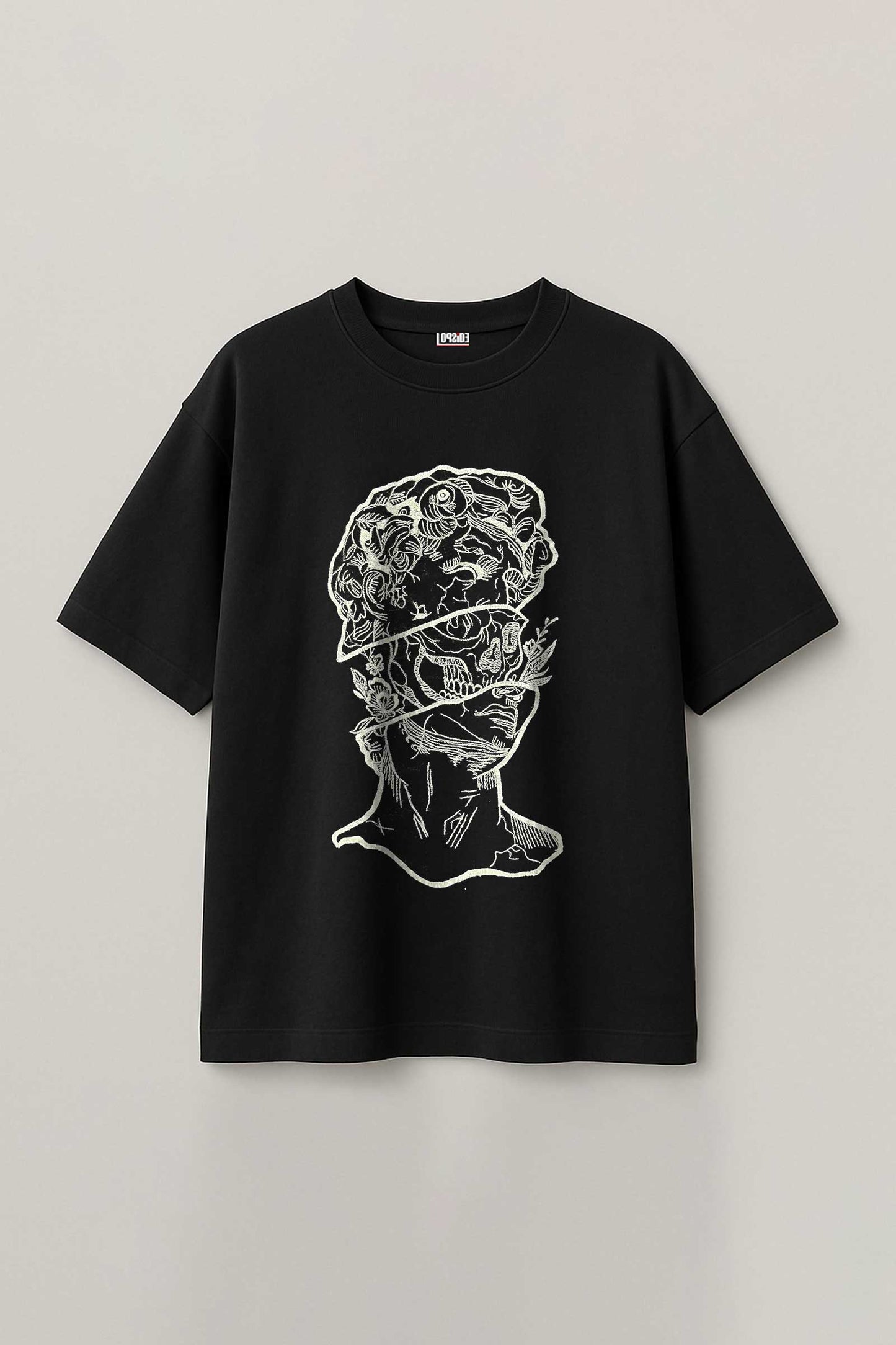 Black t-shirt with white embroidery design on a light gray background