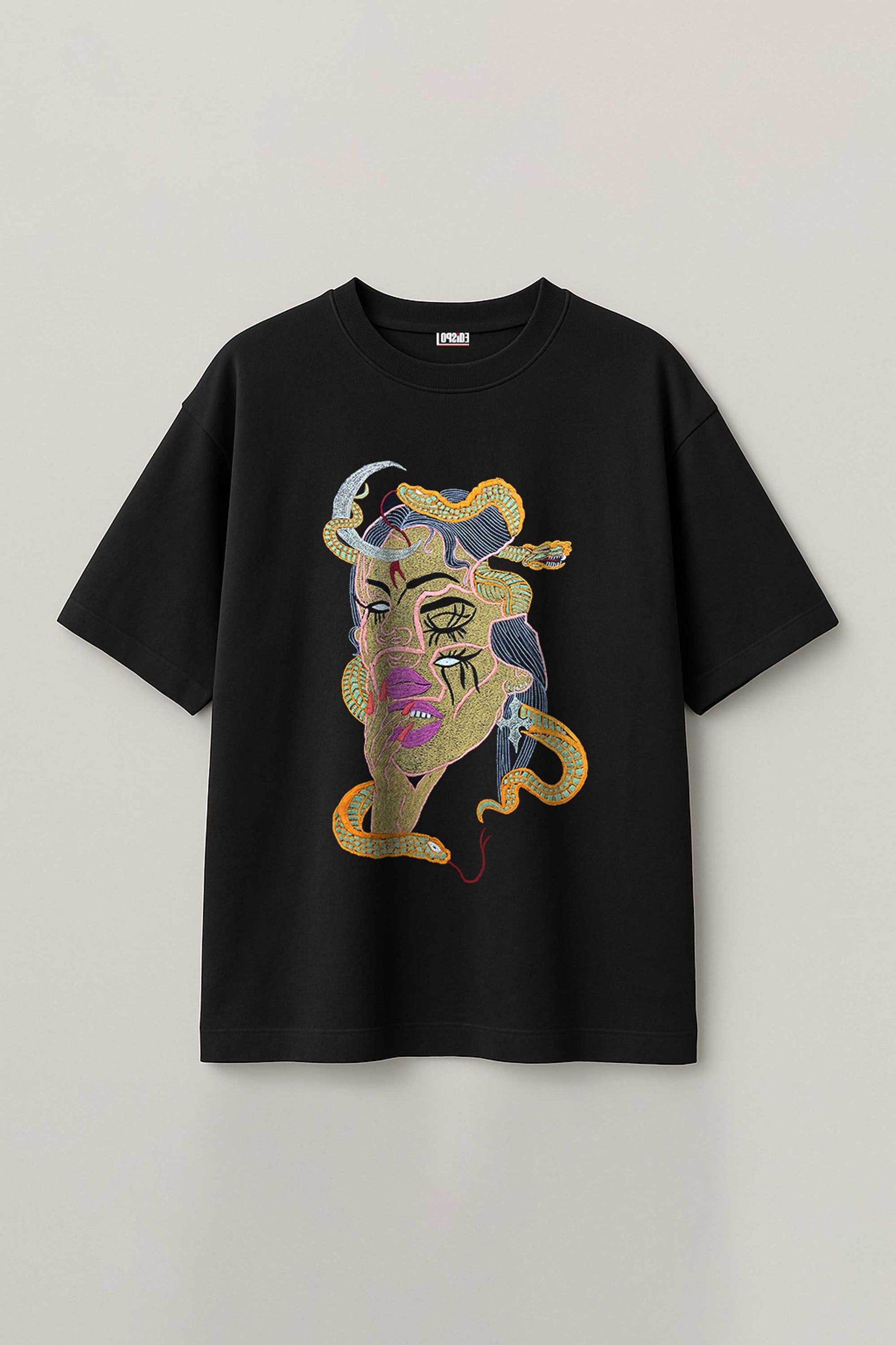 Black t-shirt with colorful embroidery design on a light gray background