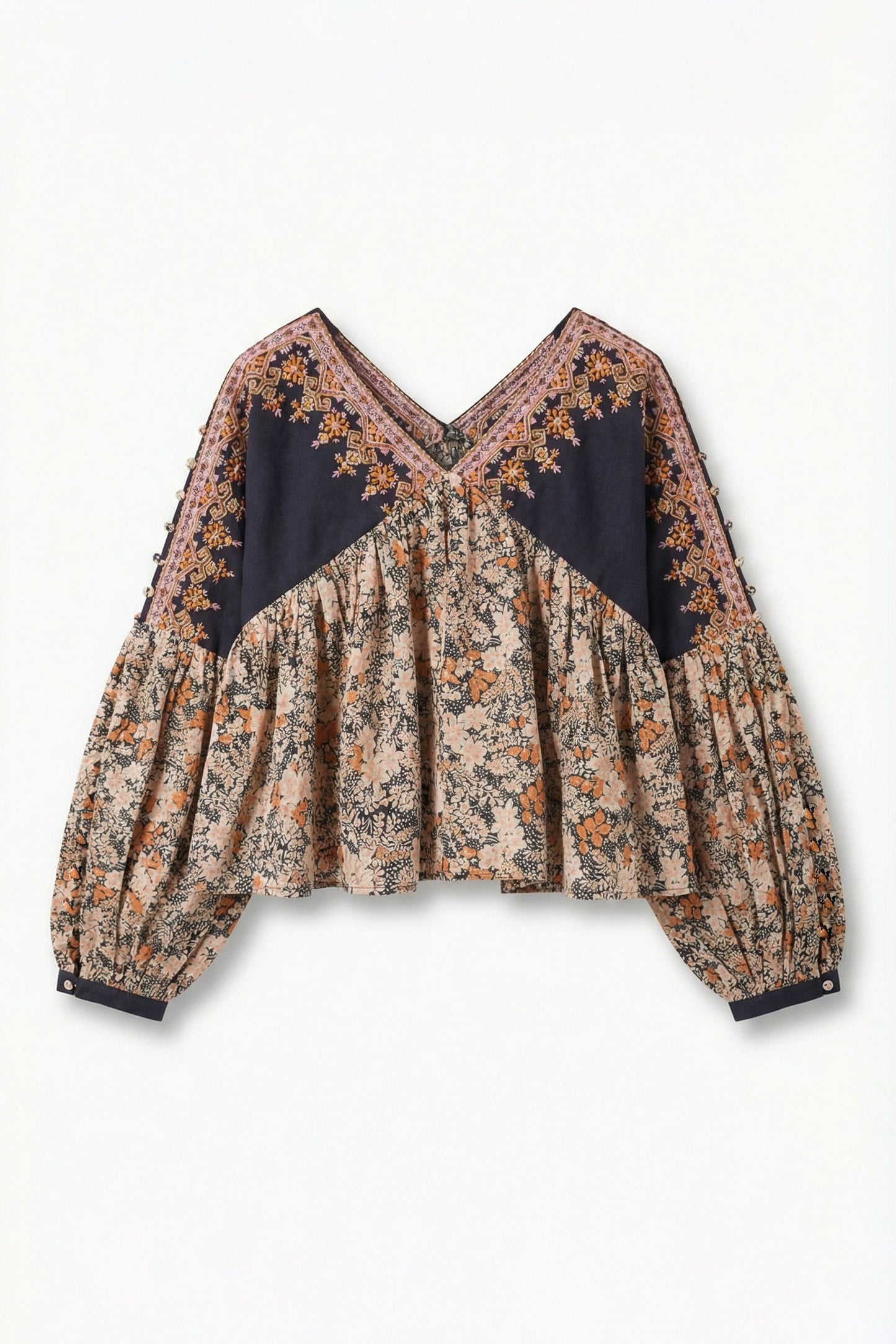 Floral blouse with black accents on a white background