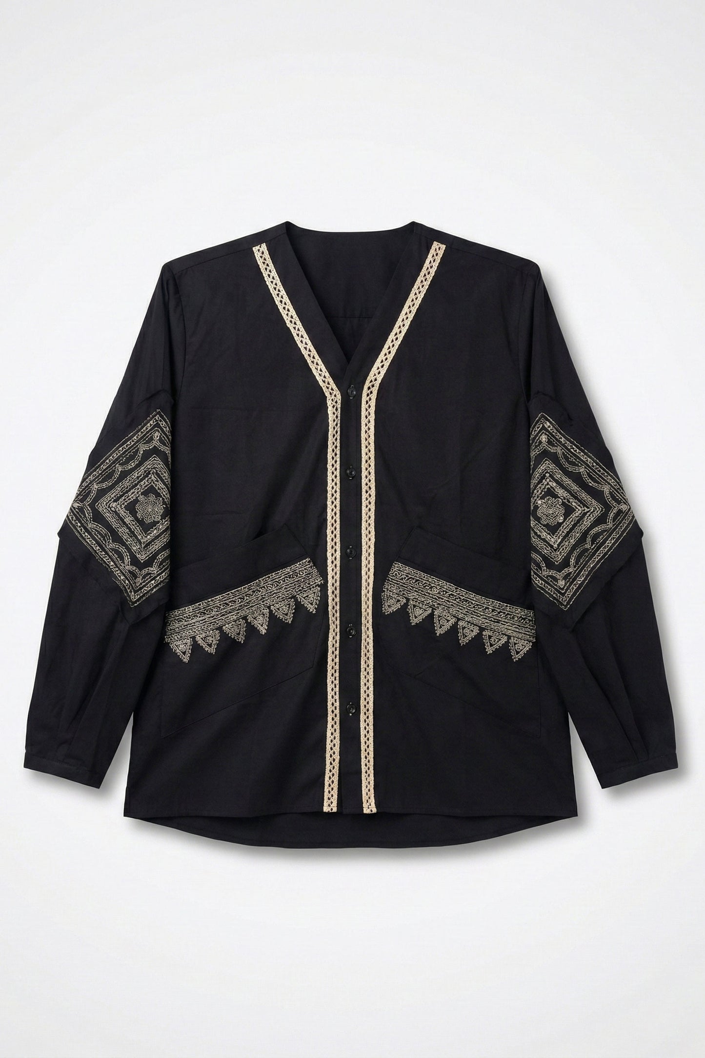 Black top with gold embroidery on a white background