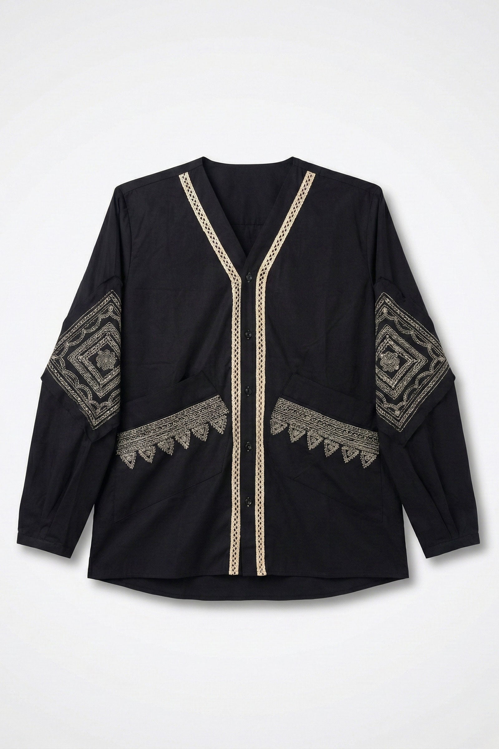 Black top with gold embroidery on a white background