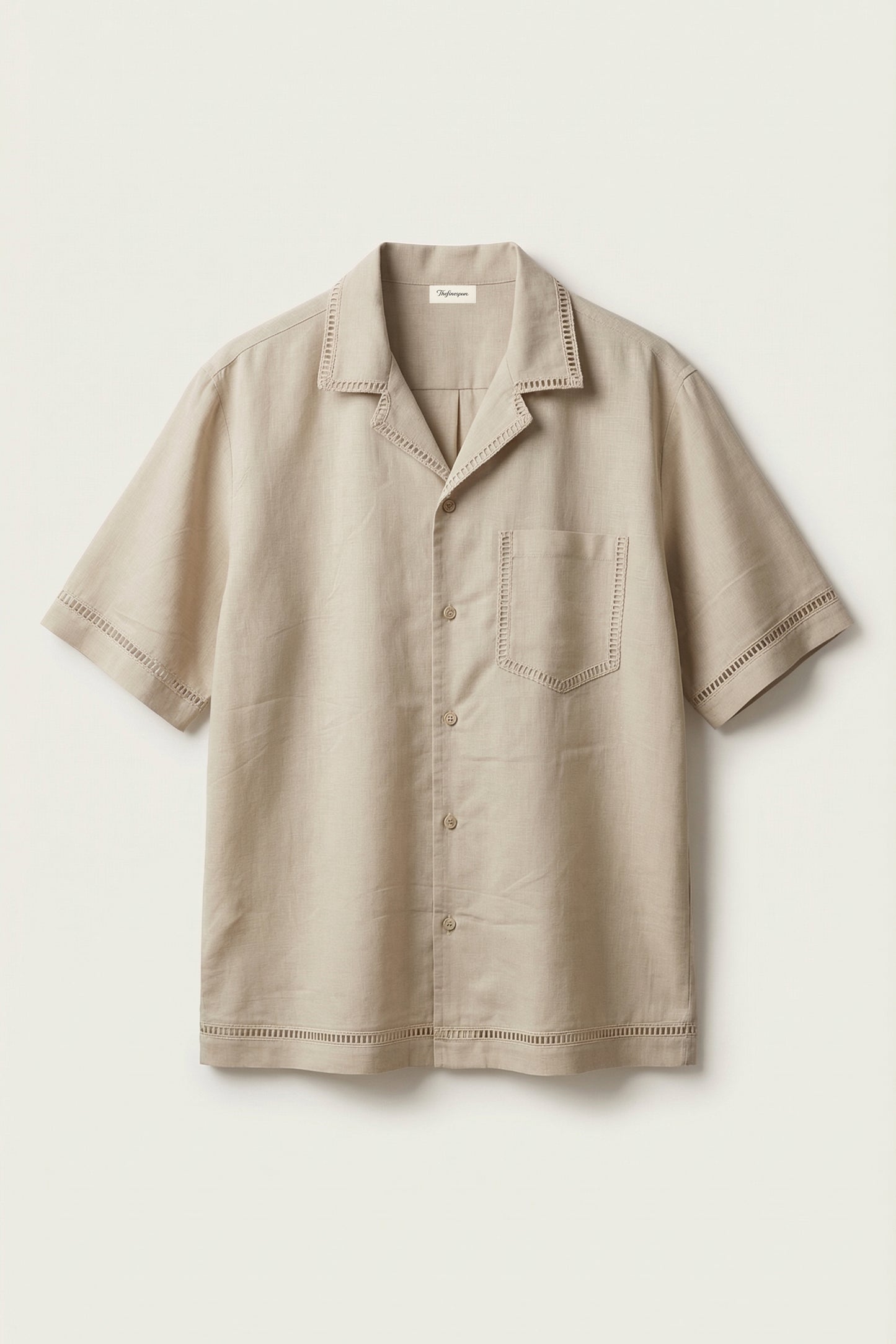 Beige short-sleeve shirt with collar and pocket on a light beige background