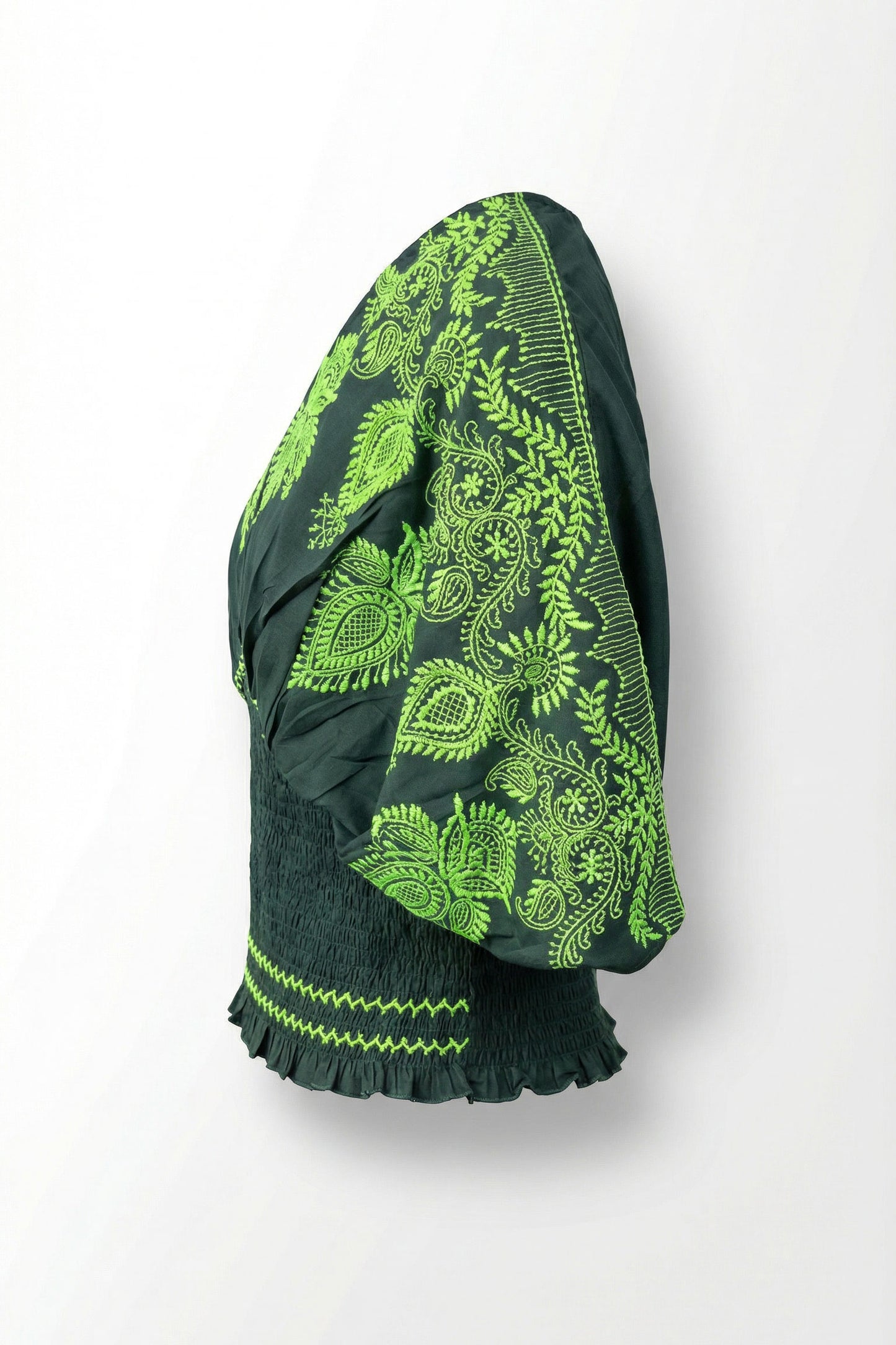 Green and black patterned fabric on a white background