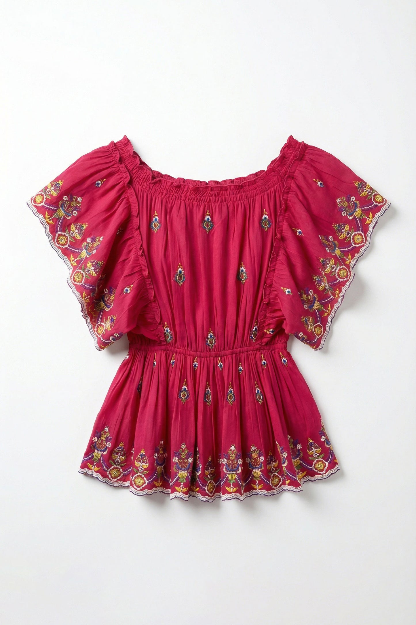 Red top with floral embroidery on a white background