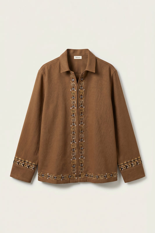 Brown shirt with decorative patterns on a beige background