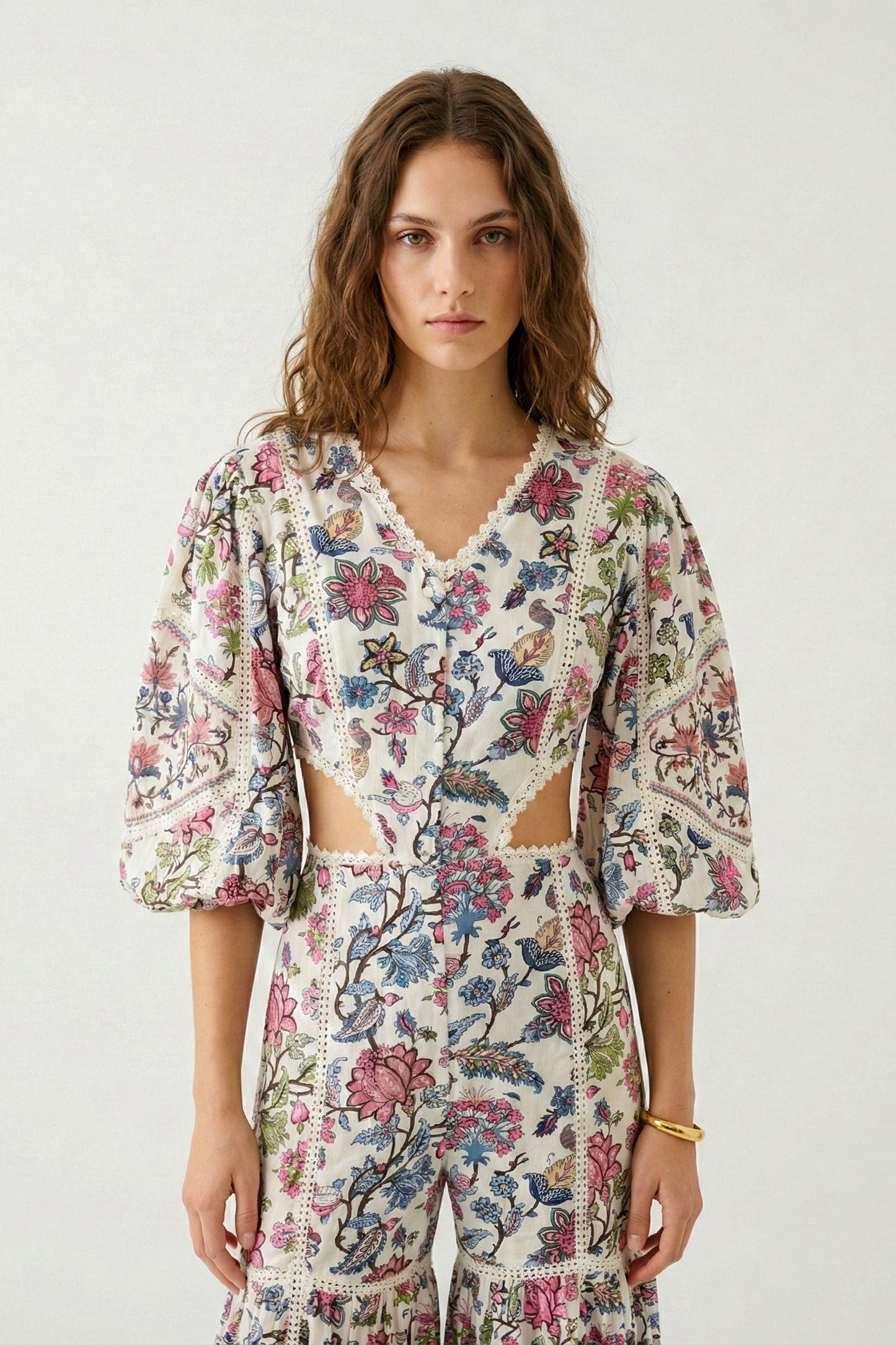 Woman wearing a floral dress with a white background