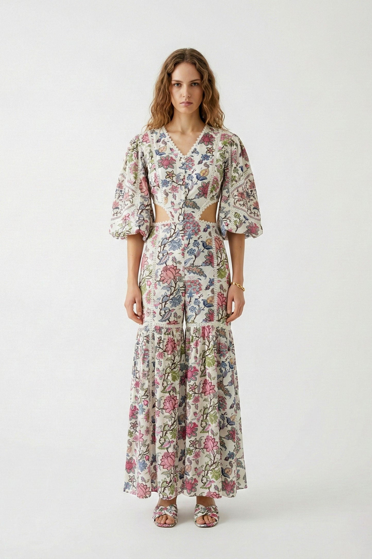 Woman wearing a floral dress on a white background