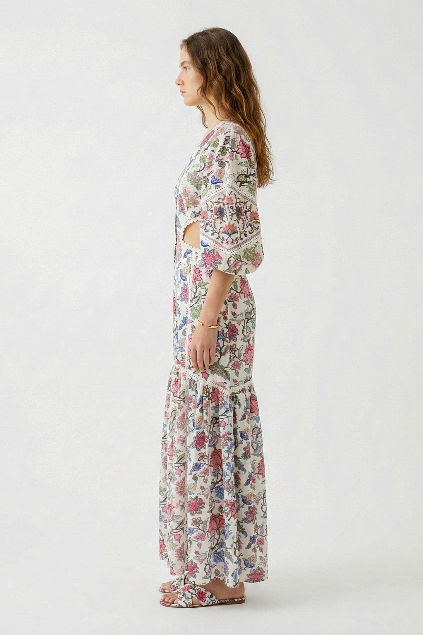 Woman wearing a floral dress on a white background