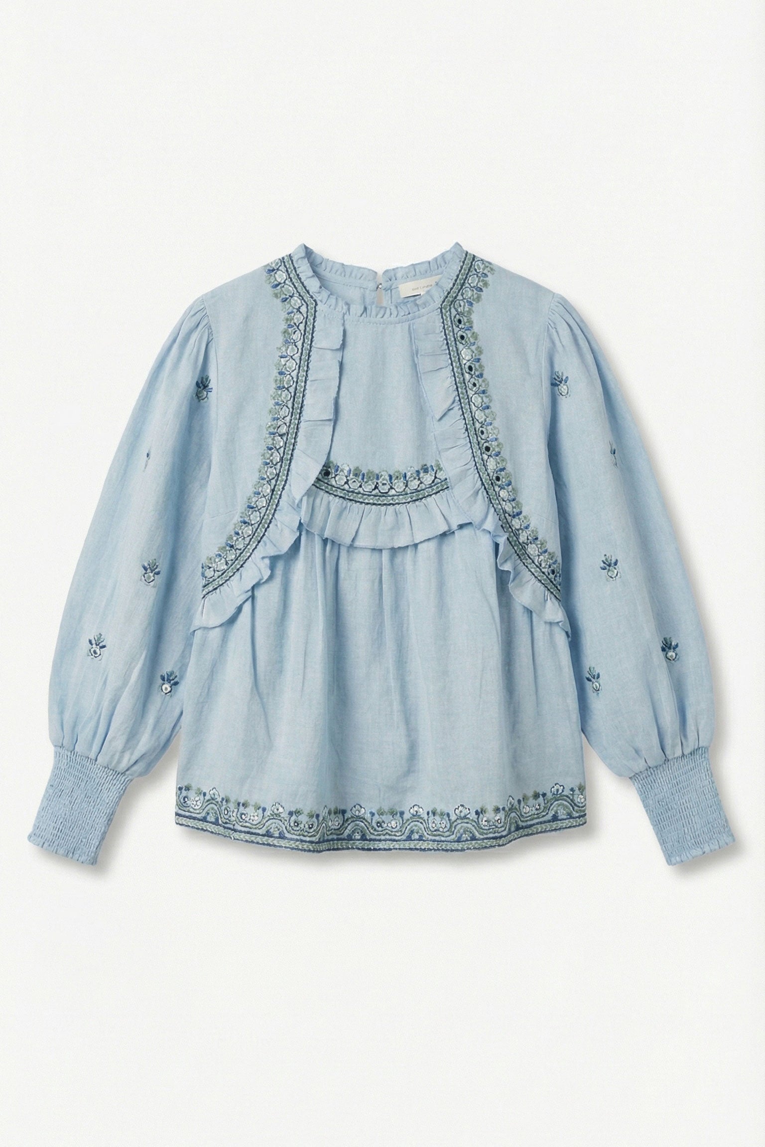 Light blue cotton top with embroidery on a white background