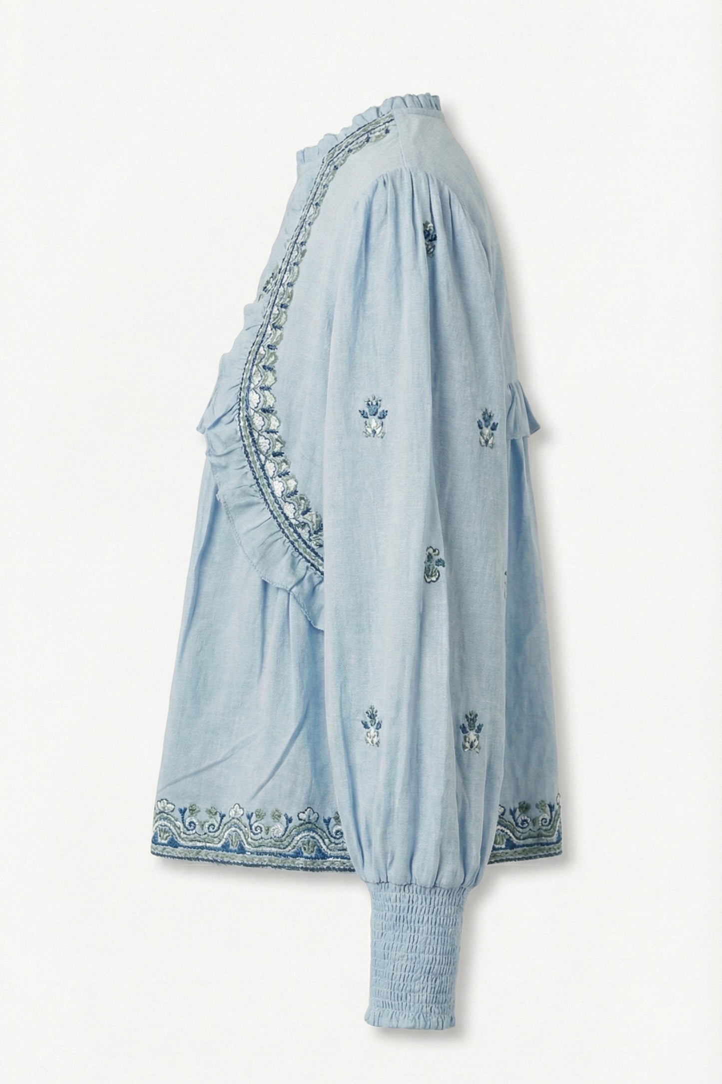 Light blue dress with intricate embroidery on a white background
