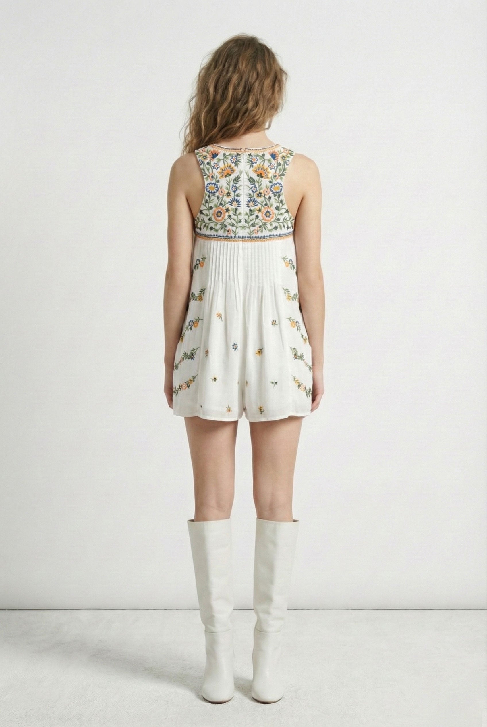 Woman wearing a floral dress with a white background