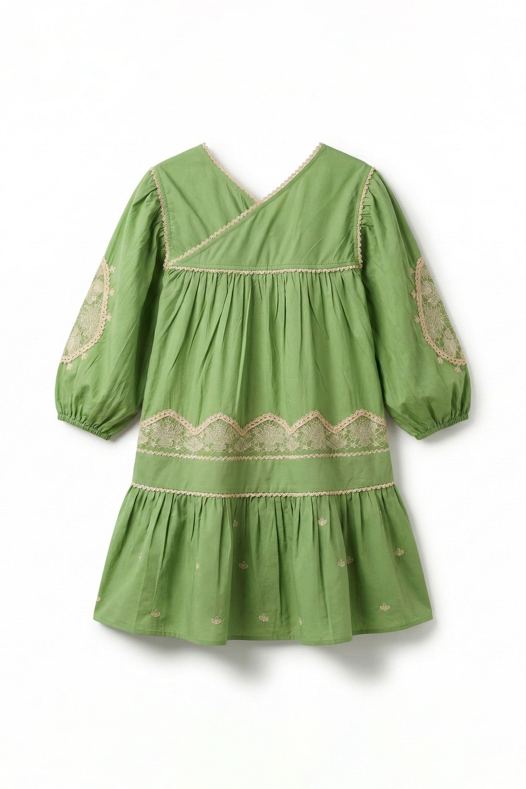 Green dress with lace details on a white background