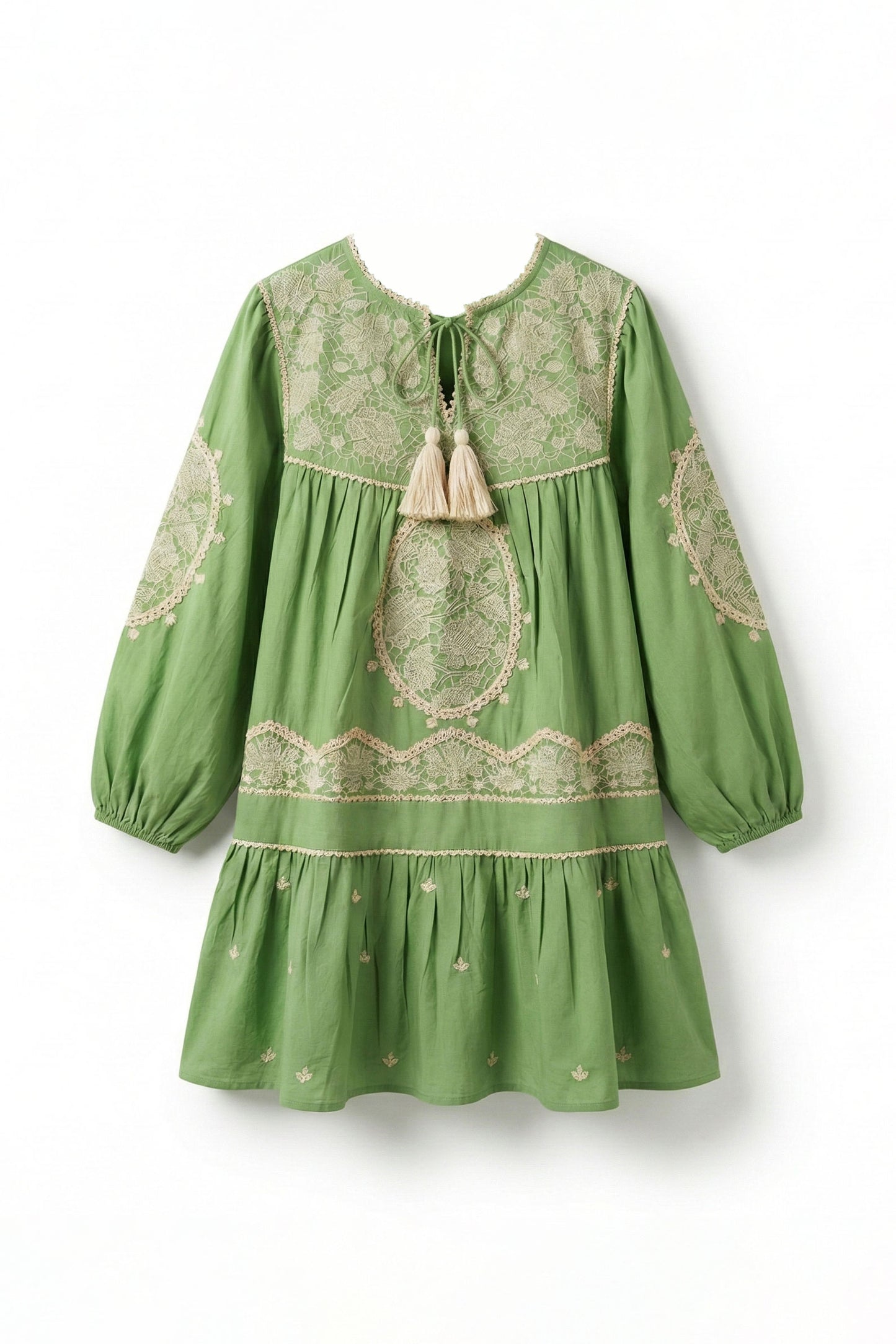Green dress with lace details on a white background