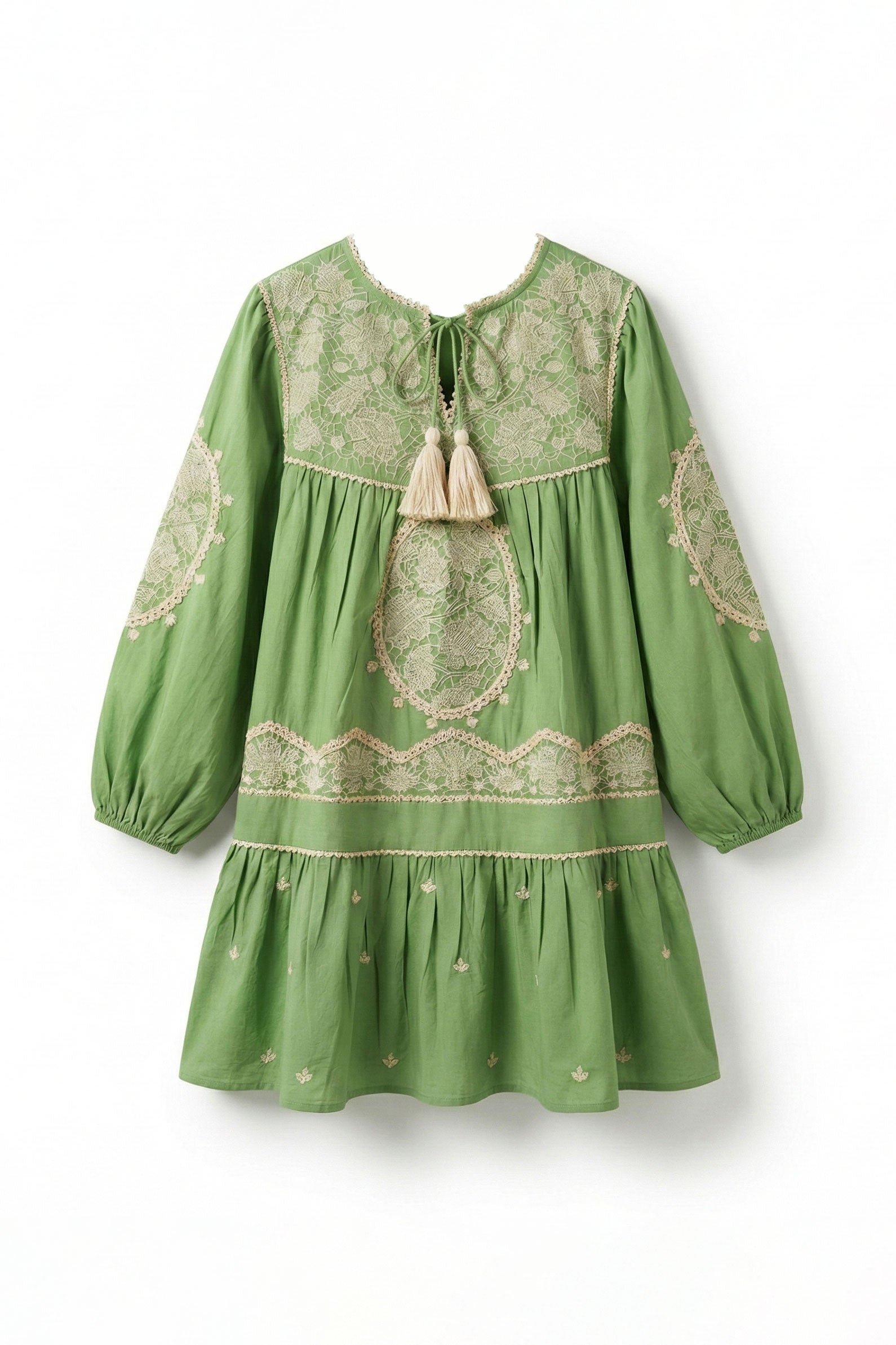 Green dress with lace details on a white background