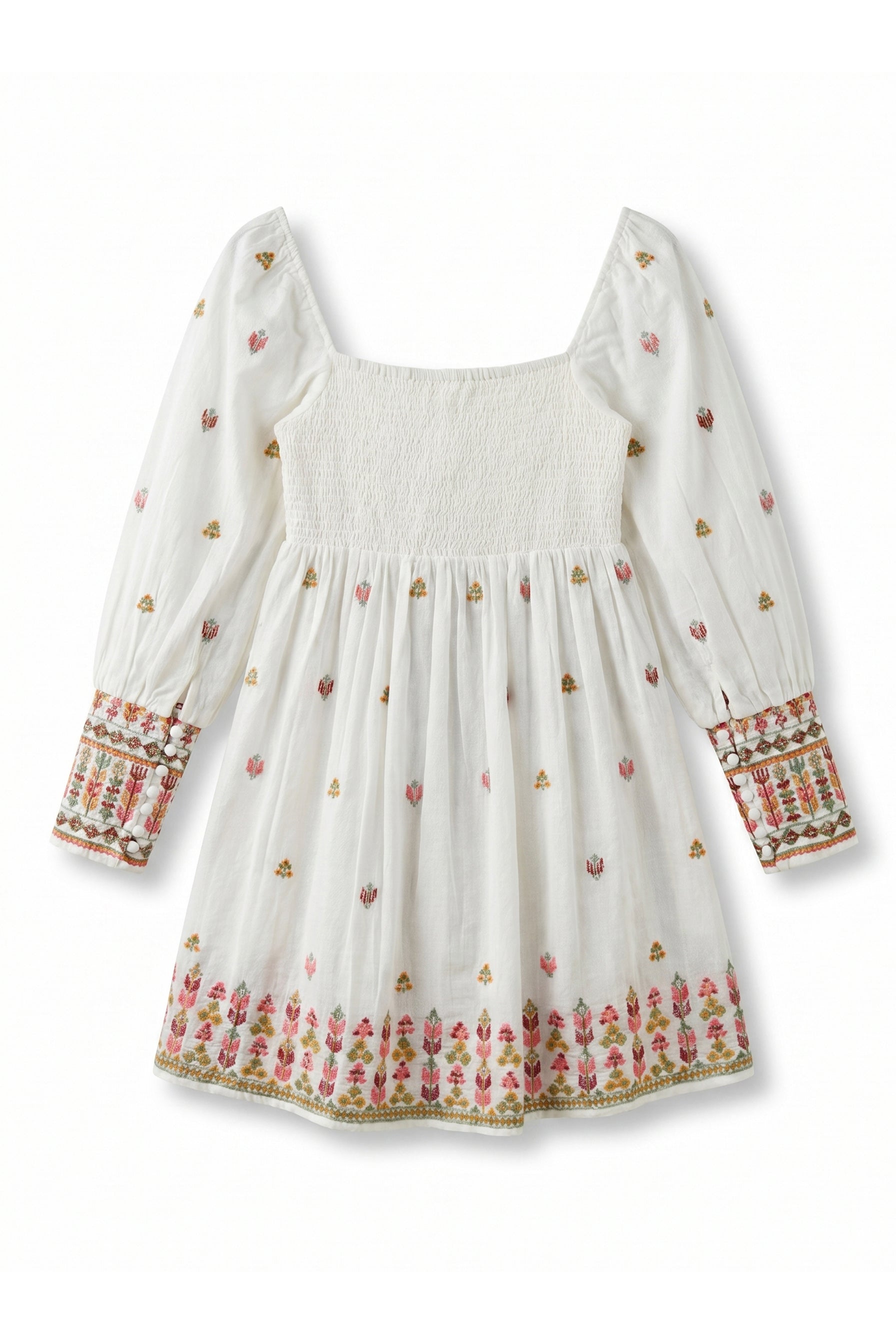 White dress with colorful floral embroidery patterns on a white background