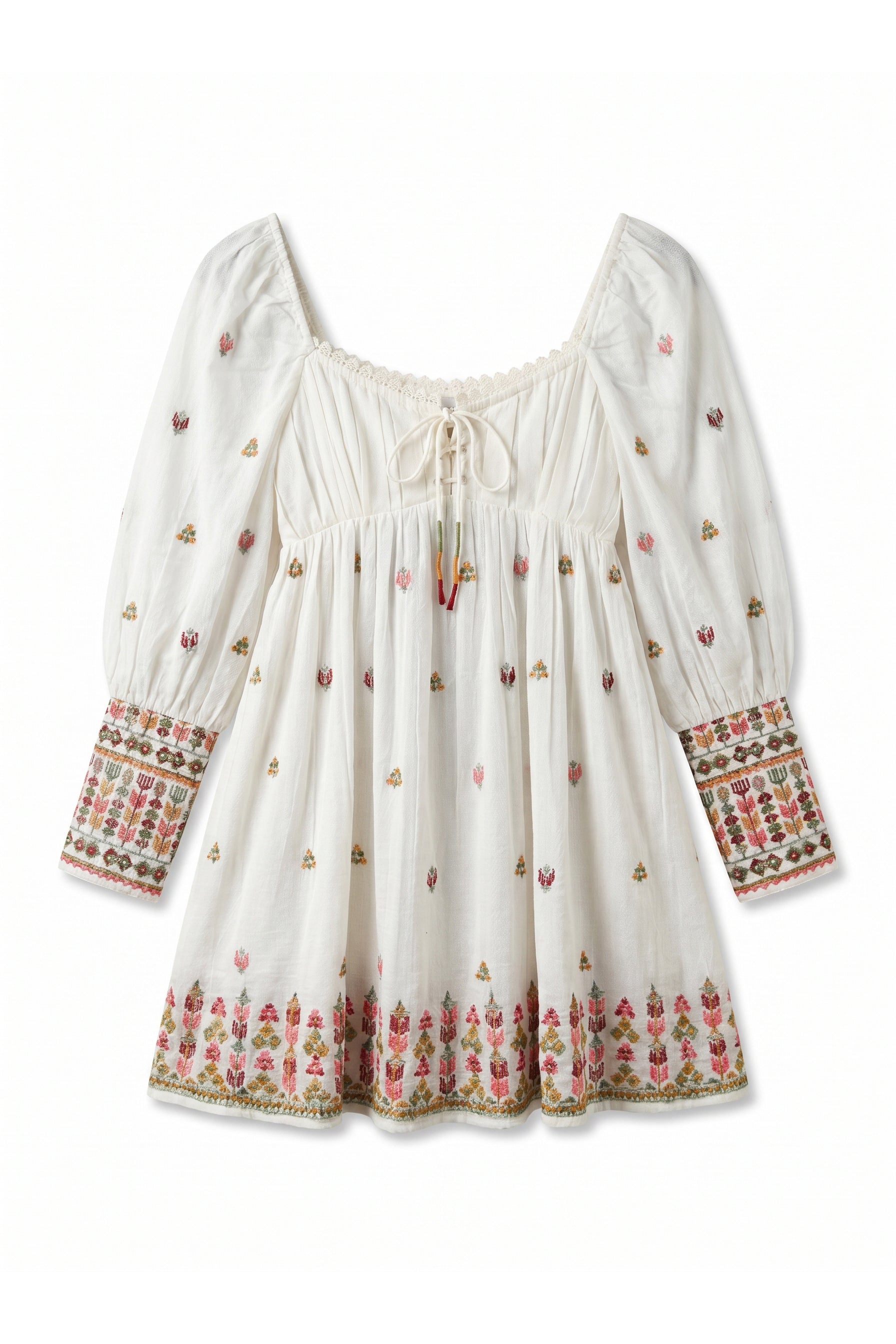 White dress with colorful floral embroidery on a white background