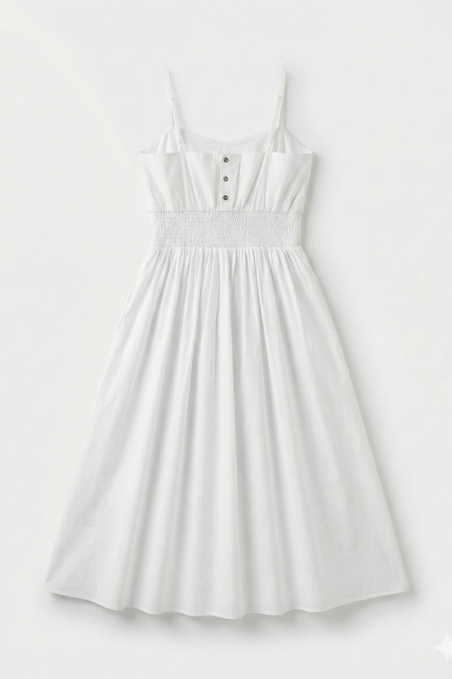 White dress with button details on a light gray background