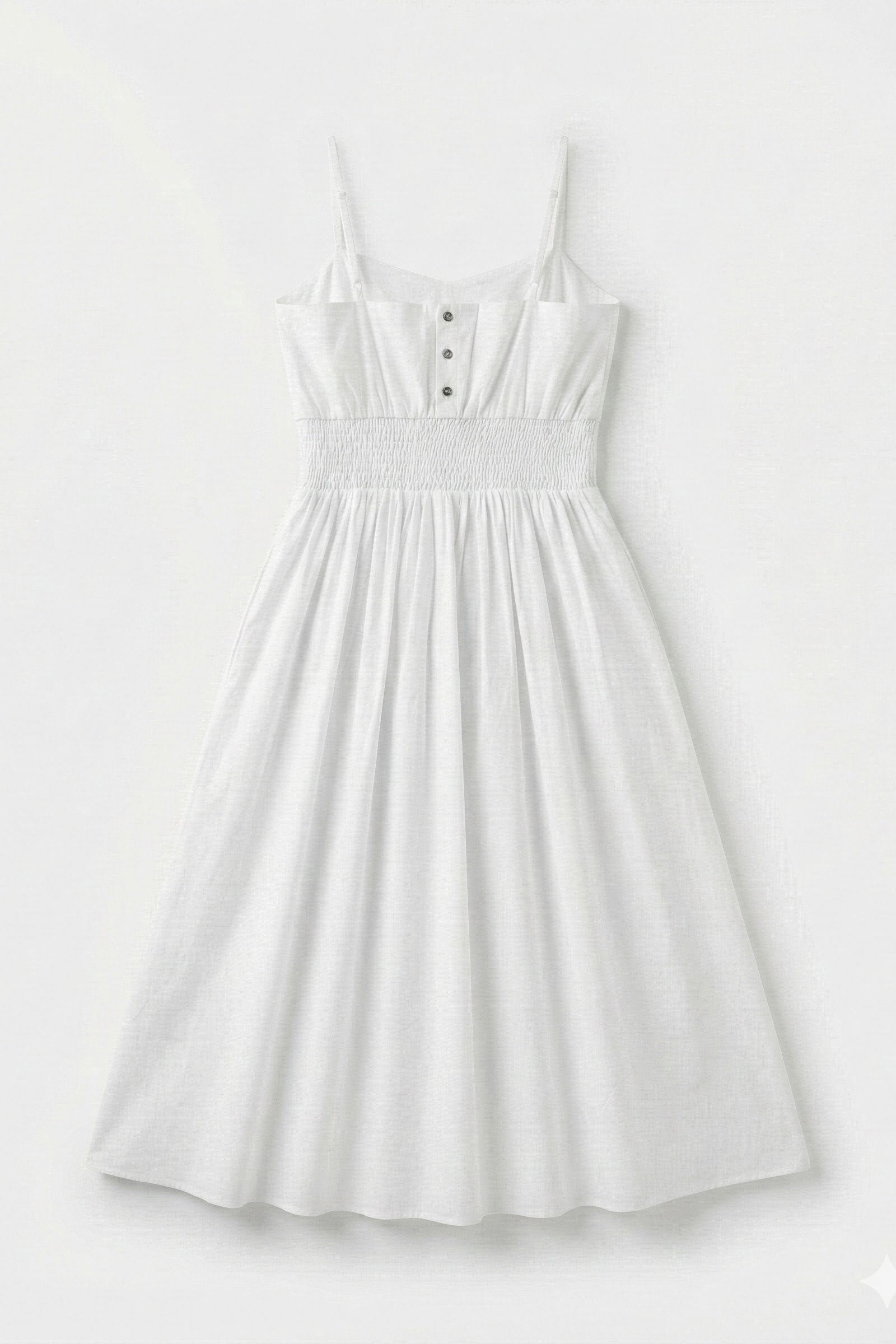 White dress with button details on a light gray background