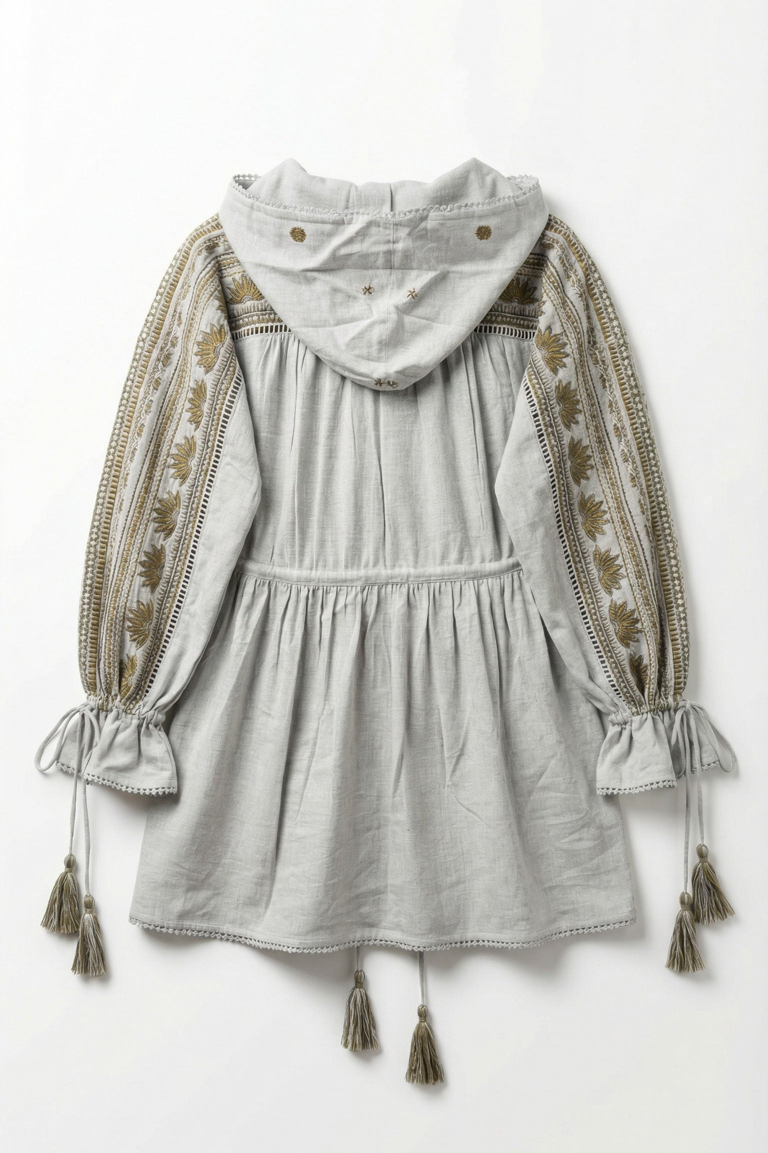 Gray dress with embroidered sleeves and tassels on a white background