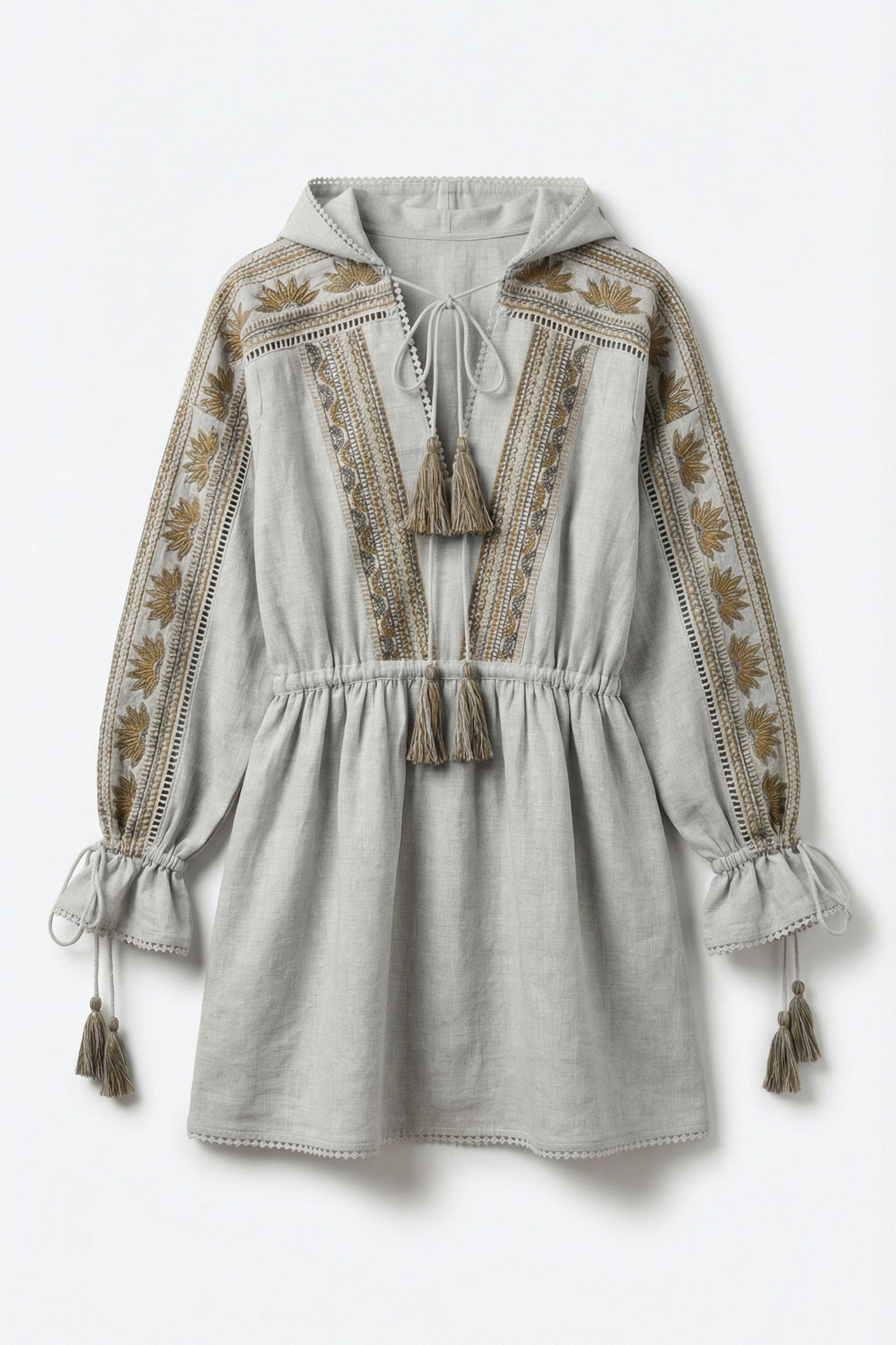 Light gray dress with intricate embroidery and tassel details on a white background