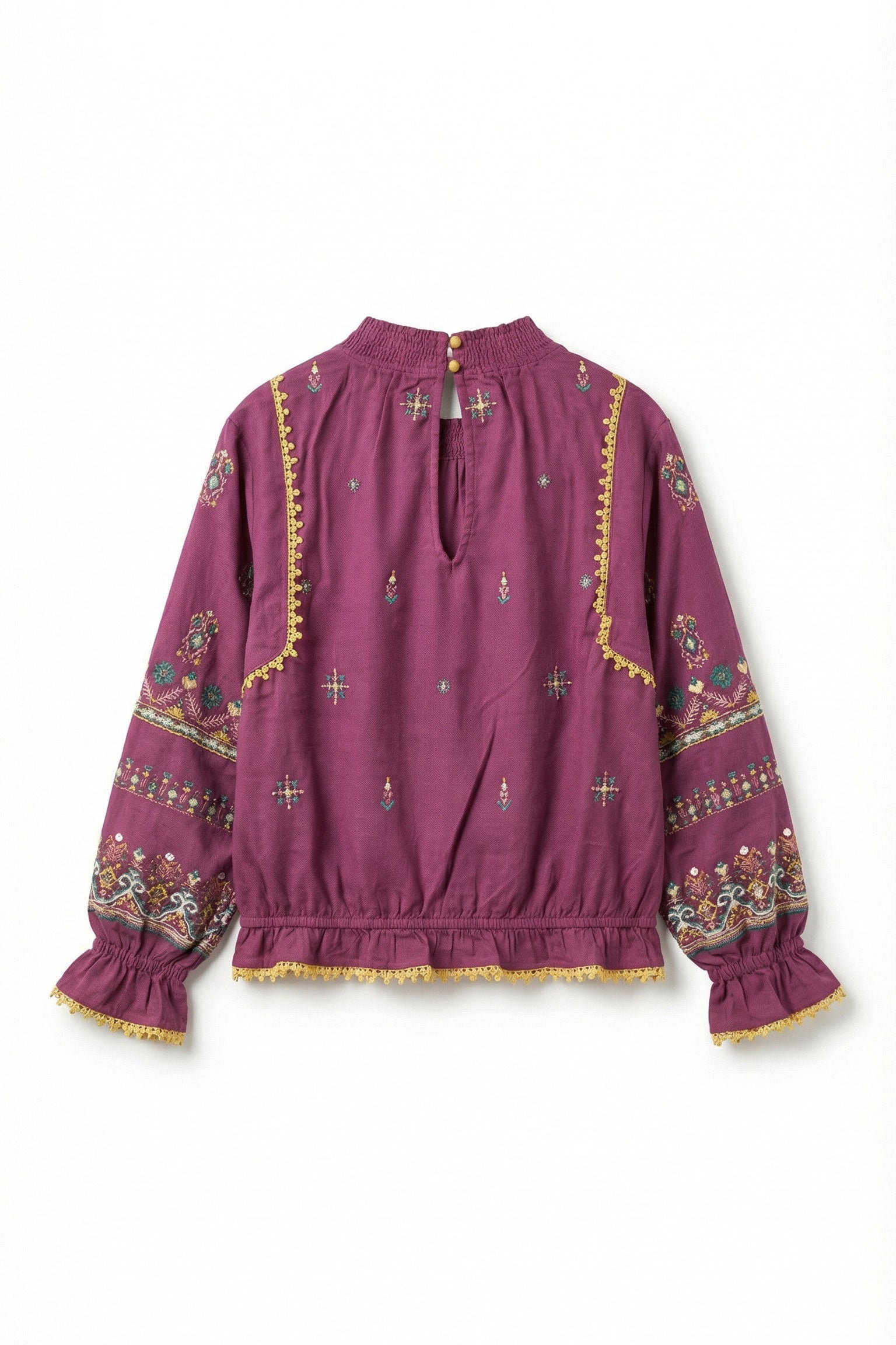 Purple blouse with intricate patterns on a white background