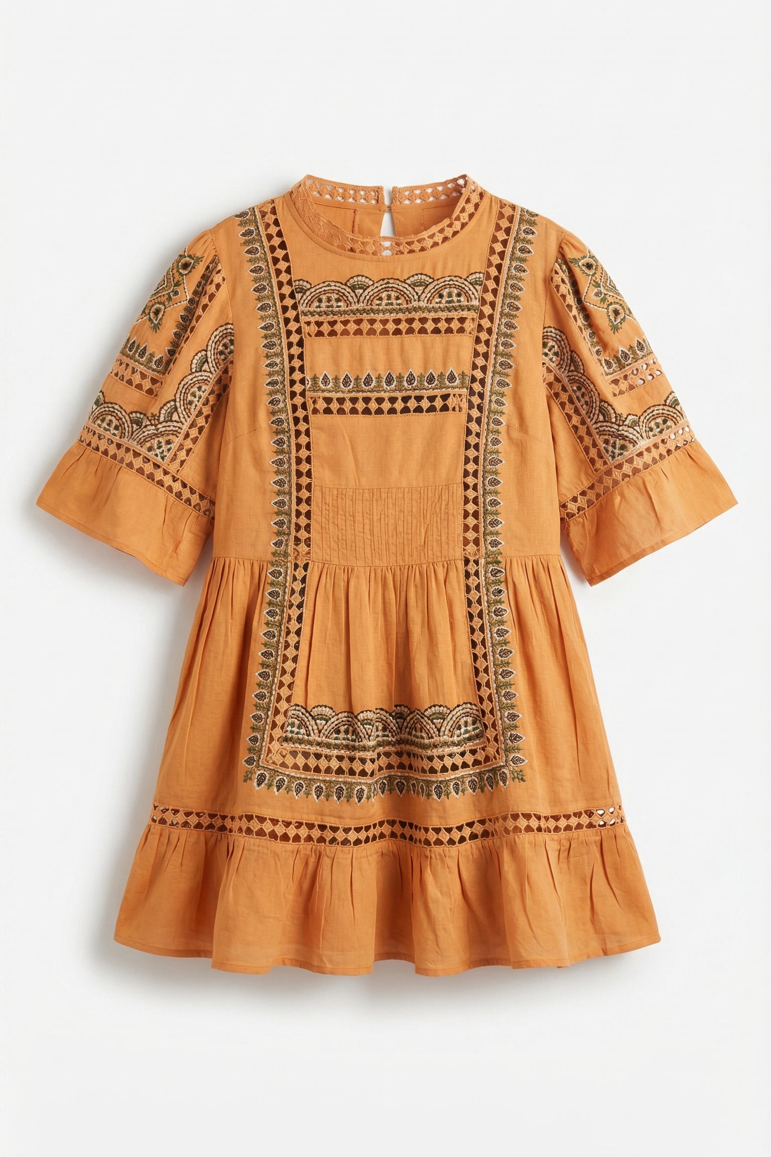 Orange dress with intricate black patterns on a white background