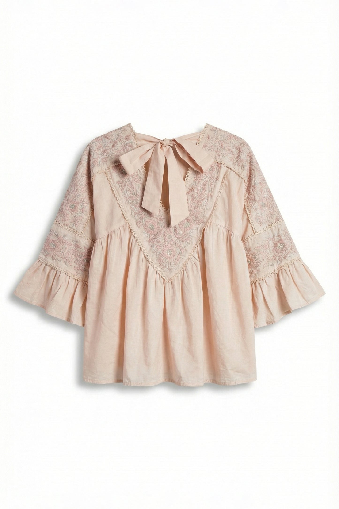 Beige blouse with lace details and a bow on a white background