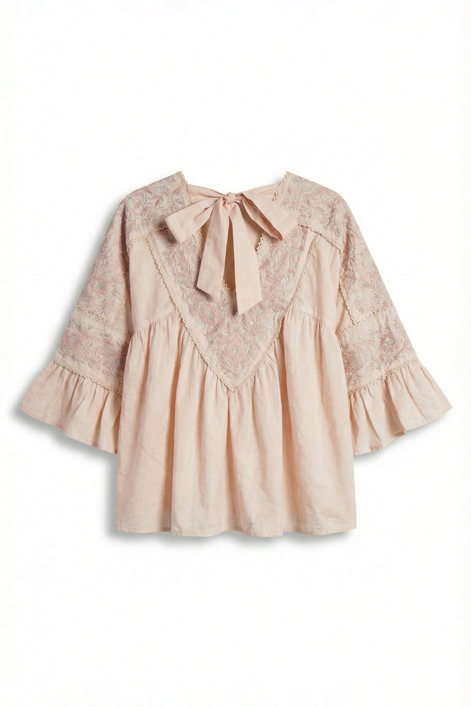 Beige blouse with lace details and a bow on a white background