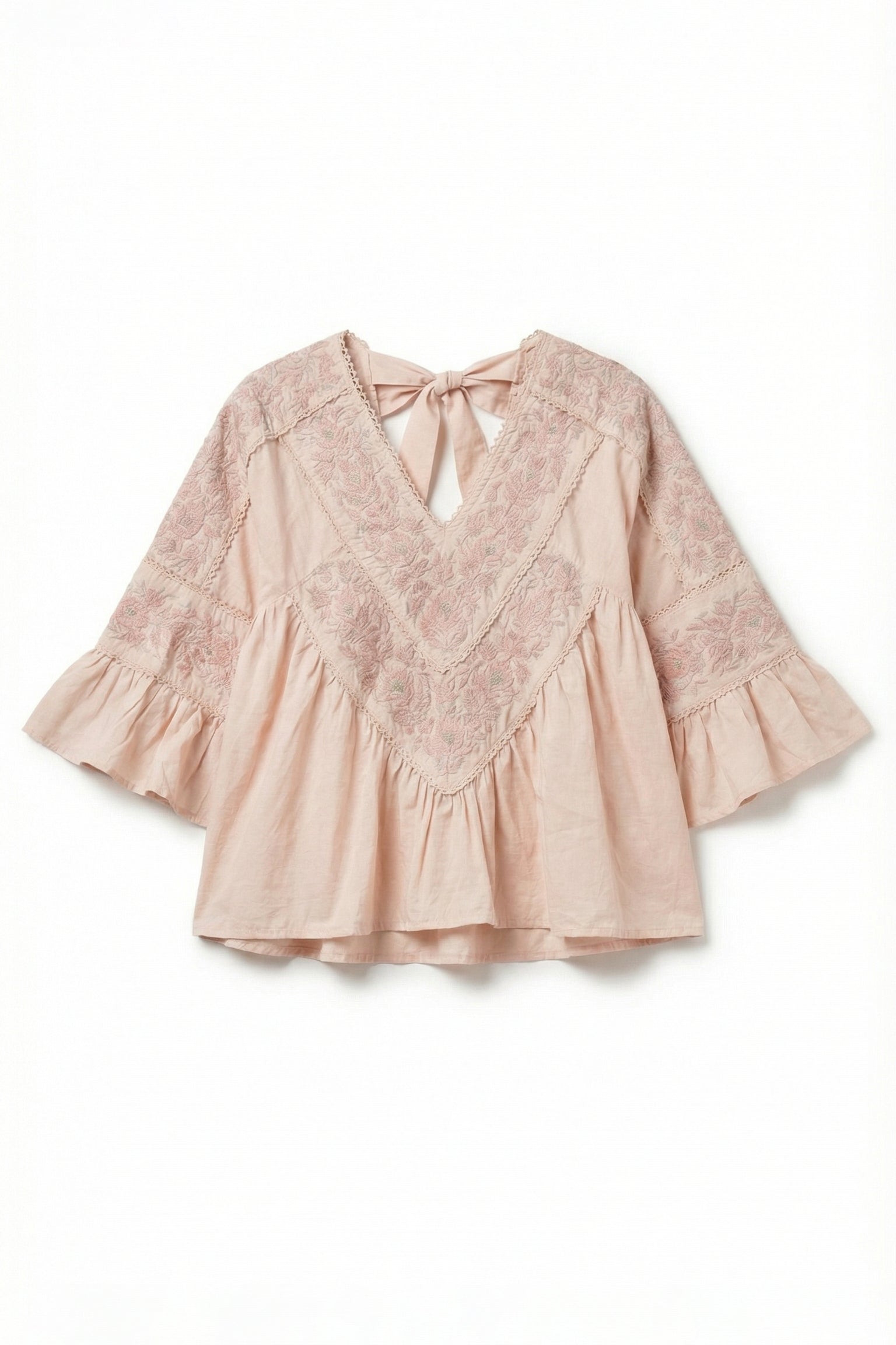 Pink lace blouse with ruffled sleeves on a white background
